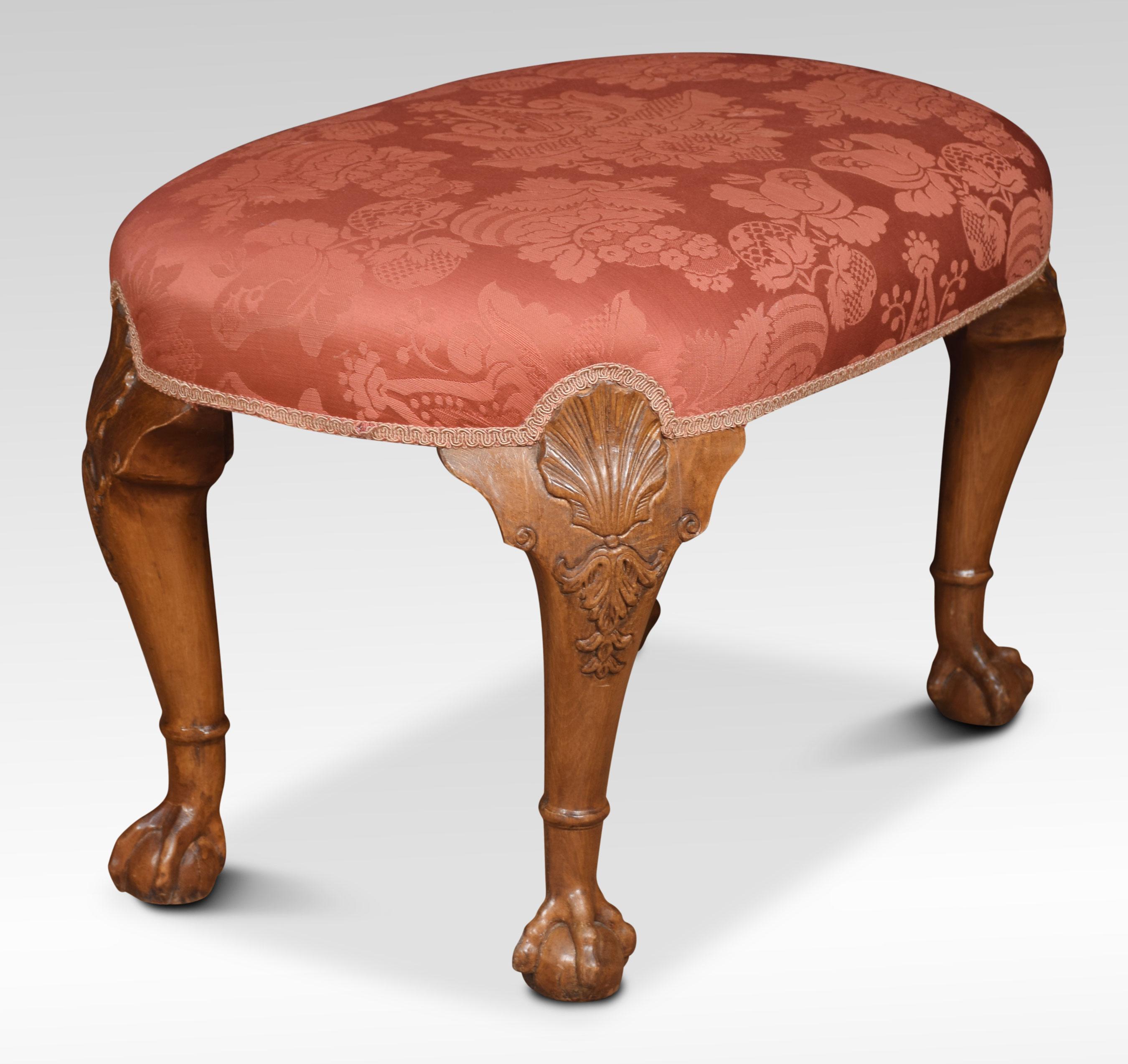 Oval shaped stool with upholstered overstuffed seat, above four walnut shell capped cabriole legs terminating in ball and claw feet.
Dimensions:
Height 18 inches
Width 29 inches
Depth 18 inches.