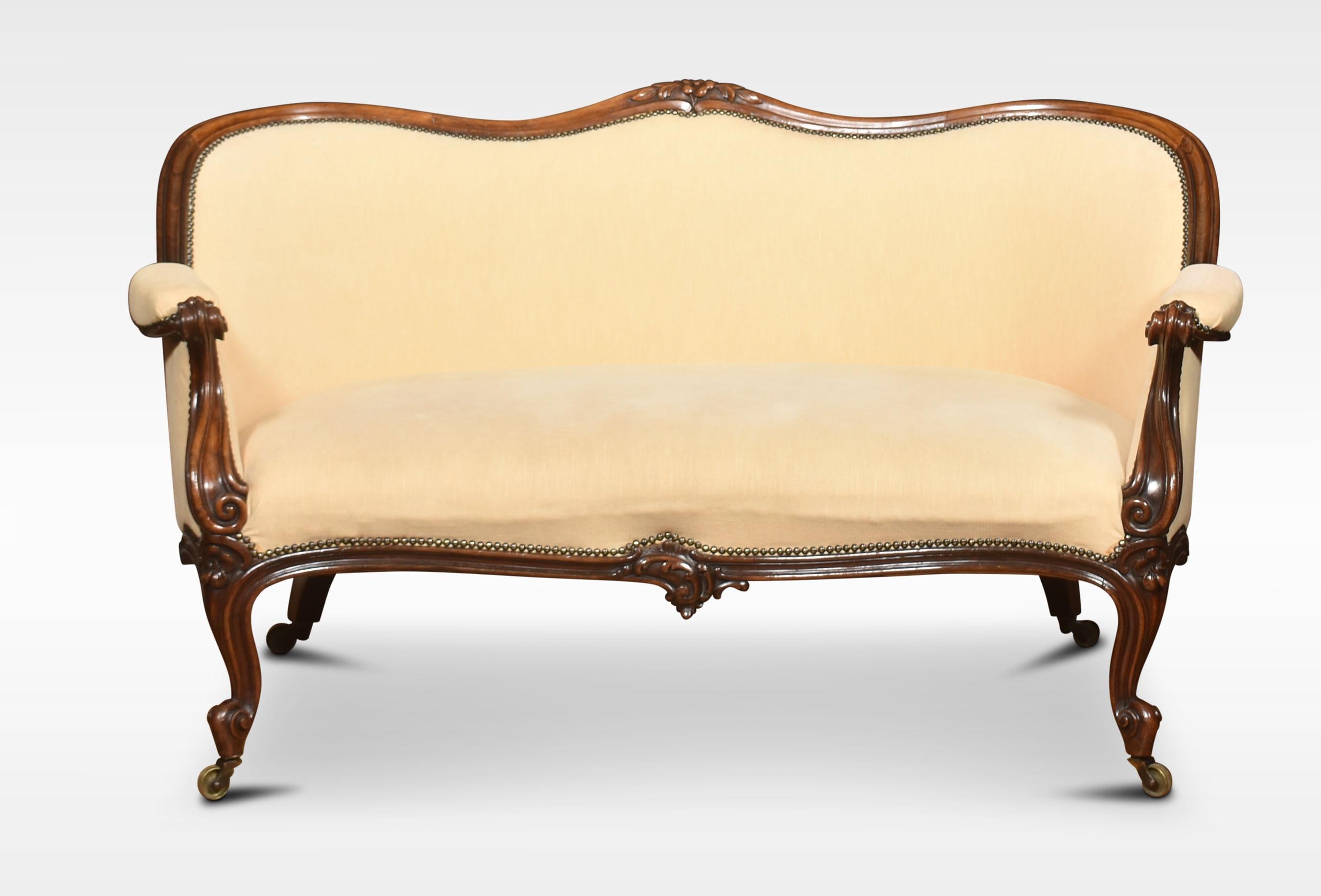 Walnut framed two-seater settee, the finely carved frame above upholstered back, seat and out swept arms. All raised up on carved cabriole legs with scrolling feet terminating in casters.
Dimensions
Height 33 Inches height to seat 17 Inches
Width