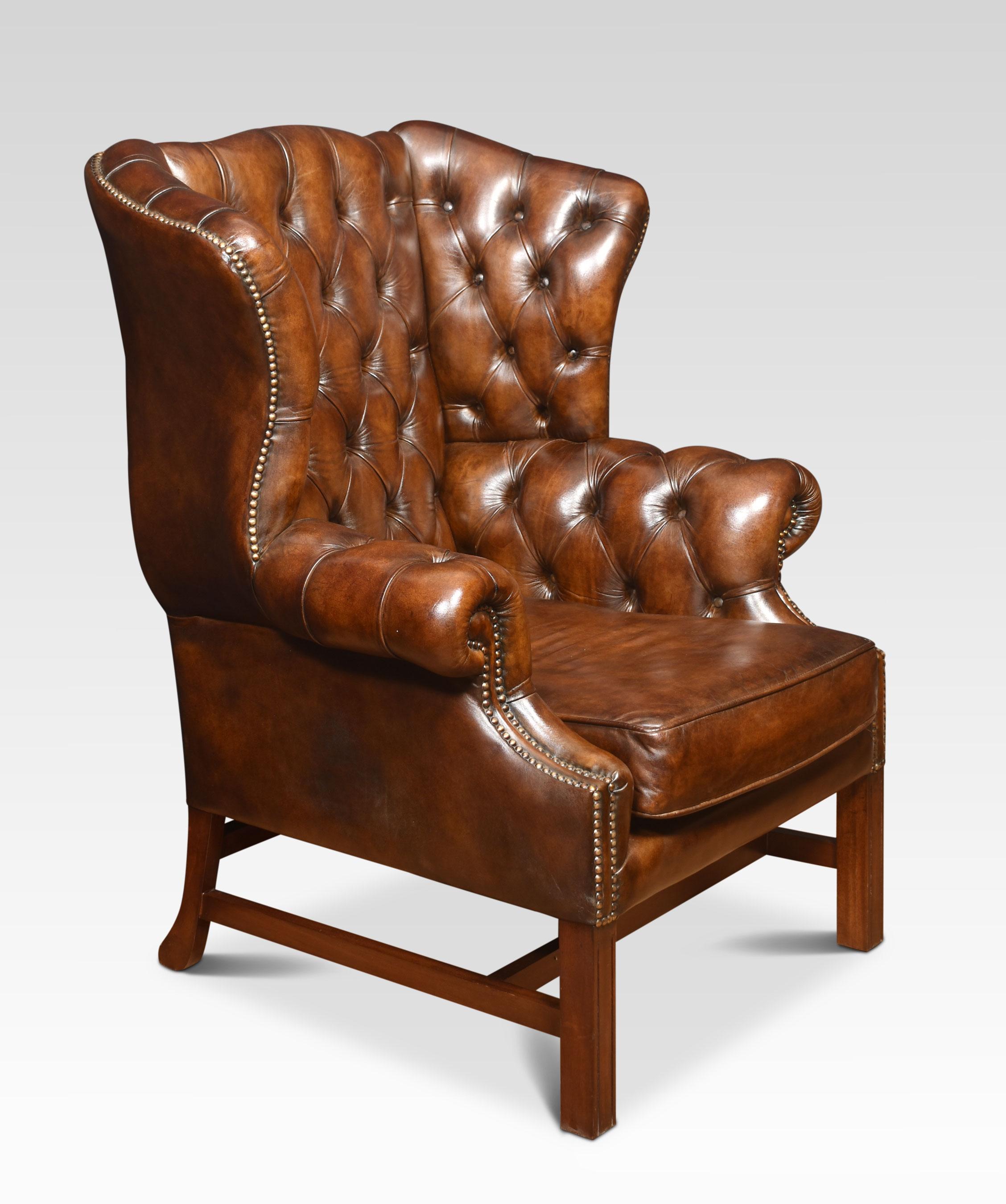 Walnut framed wing armchair of generous proportions, the arched top above deep buttoned back, upholstered arms, and seat in brown leather. All raised up on square supports united by a stretcher
Dimensions
Height 43 Inches height to seat 19