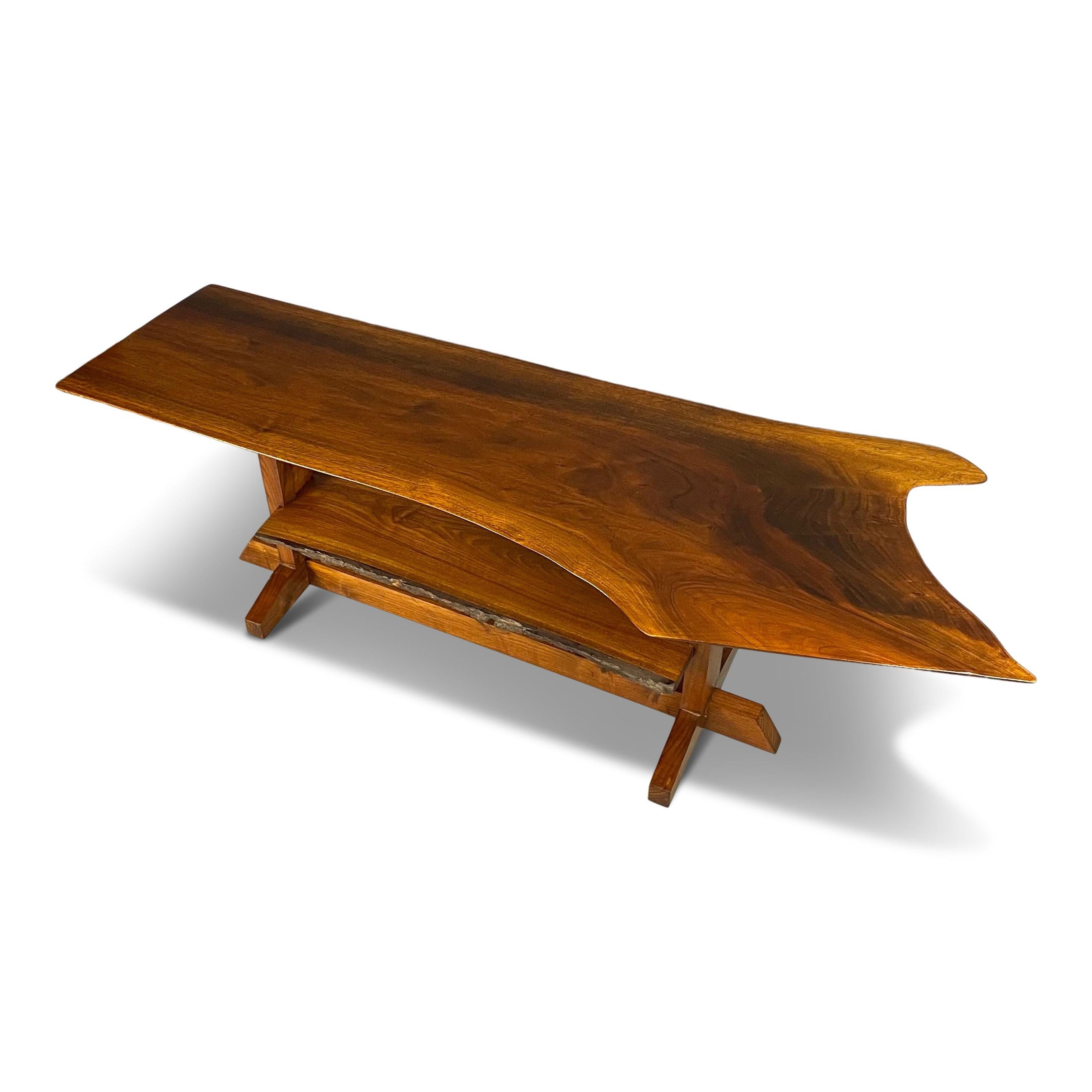 Astoundingly beautifully grained walnut slab coffee table hand made by a local Pennsylvania artisan. This table will provide a lovely transition of the forest into your living spaces... bringing the outside in!.