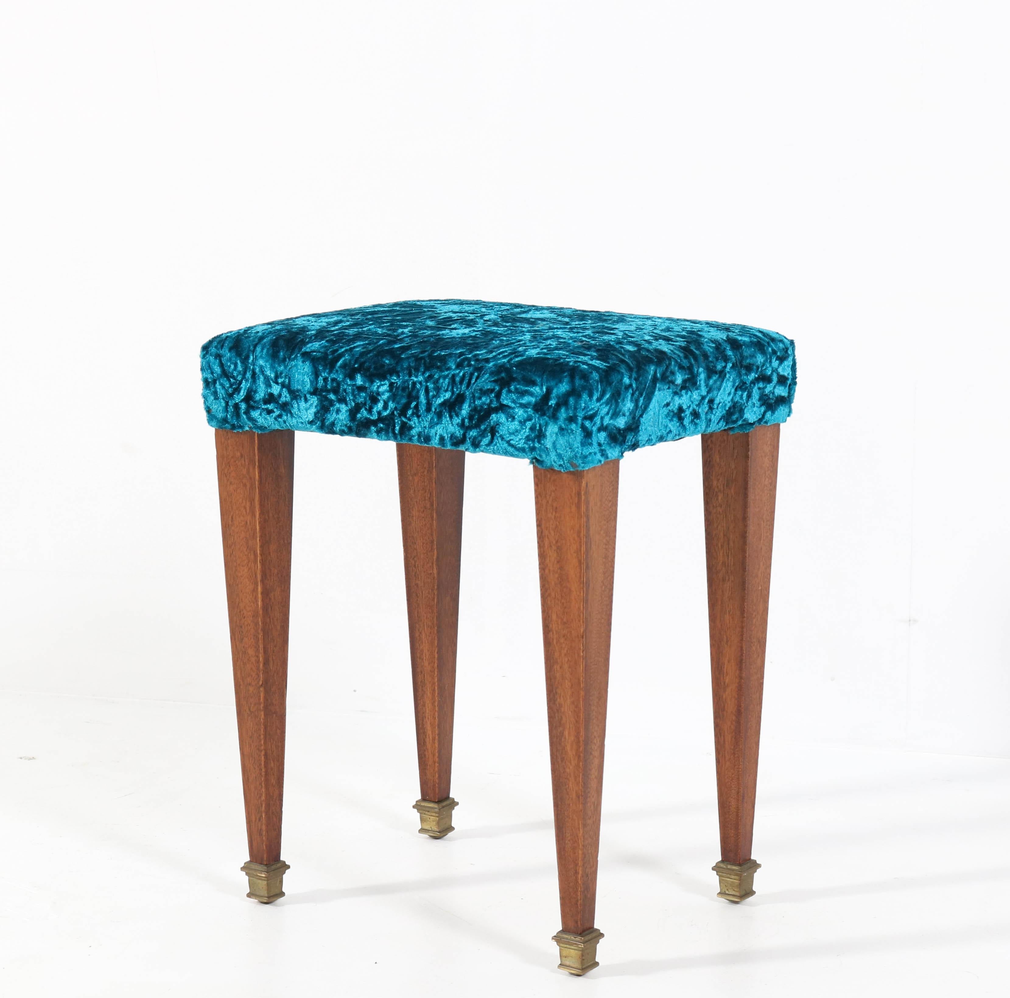 Stunning and rare Art Deco stool.
Striking French design from the 1930s.
Walnut base with brass feet.
New upholstered with high quality Italian fabric.
In very good condition with a beautiful patina.