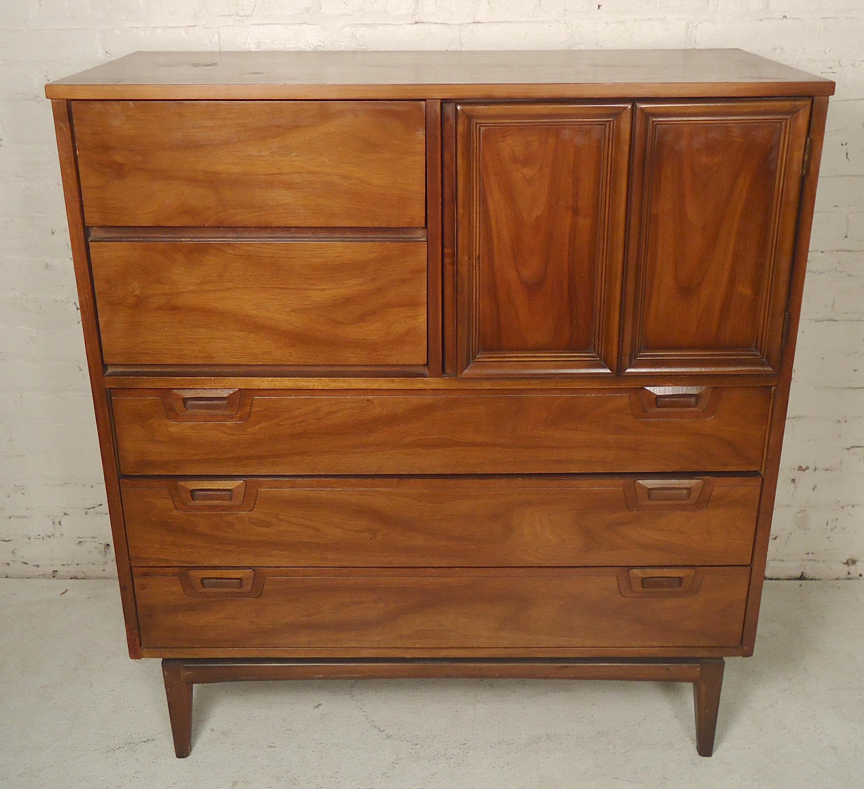 Mid-Century Modern dresser with top storage compartment. Warm walnut grain, sculpted handles, tapered legs.

(Please confirm item location - NY or NJ - with dealer).
    