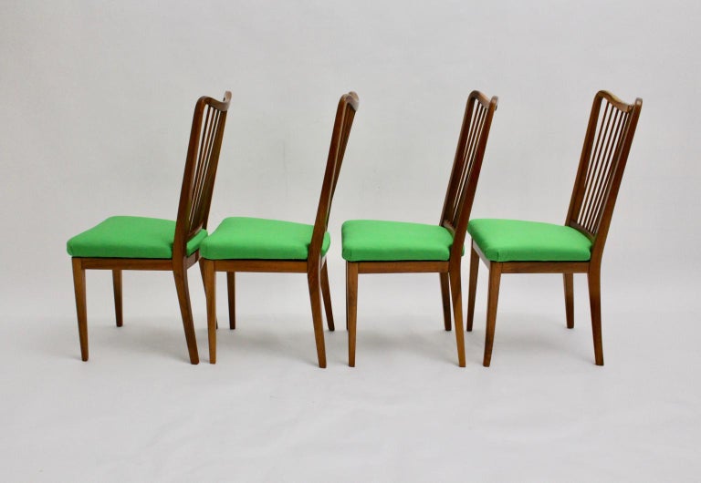 Mid Century Modern set of 4 Mid-Century Modern dining chairs design attributed to Oswald Haerdtl.
Oswald Haerdtl, (1899-1959)
The dining chairs were made of solid walnut with beautiful wood grain and show loose upholstered seats. The grass green