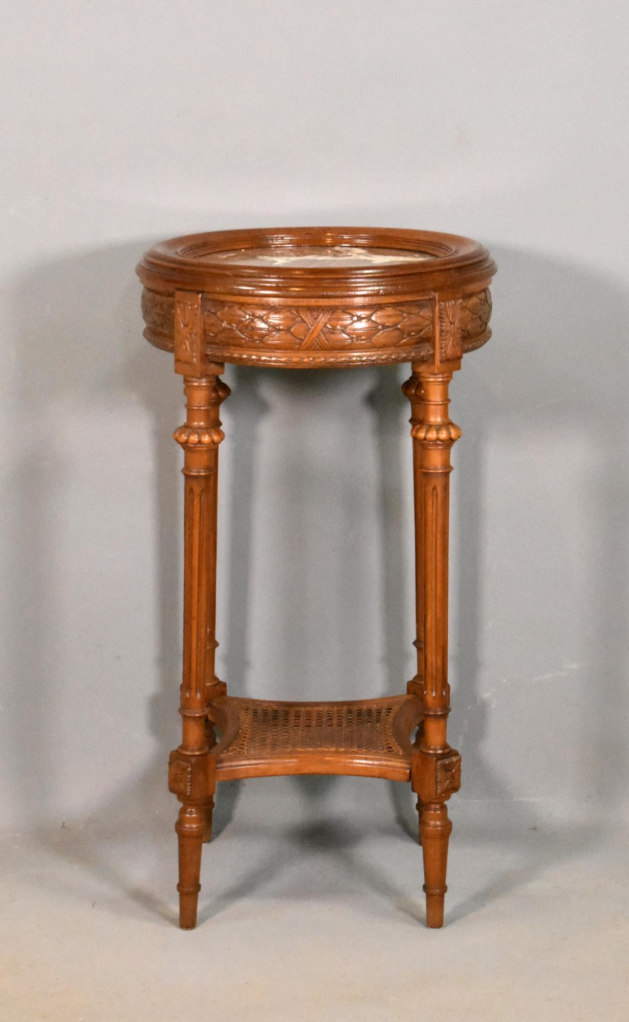 Walnut Gueridon Side Table Directoire Period

A beautifully crafted walnut gueridon features a red, white and grey variegated marble set into a turned moulded frame. 

The frieze below depicts a laurel leaf band and rope moulding. 

The turned