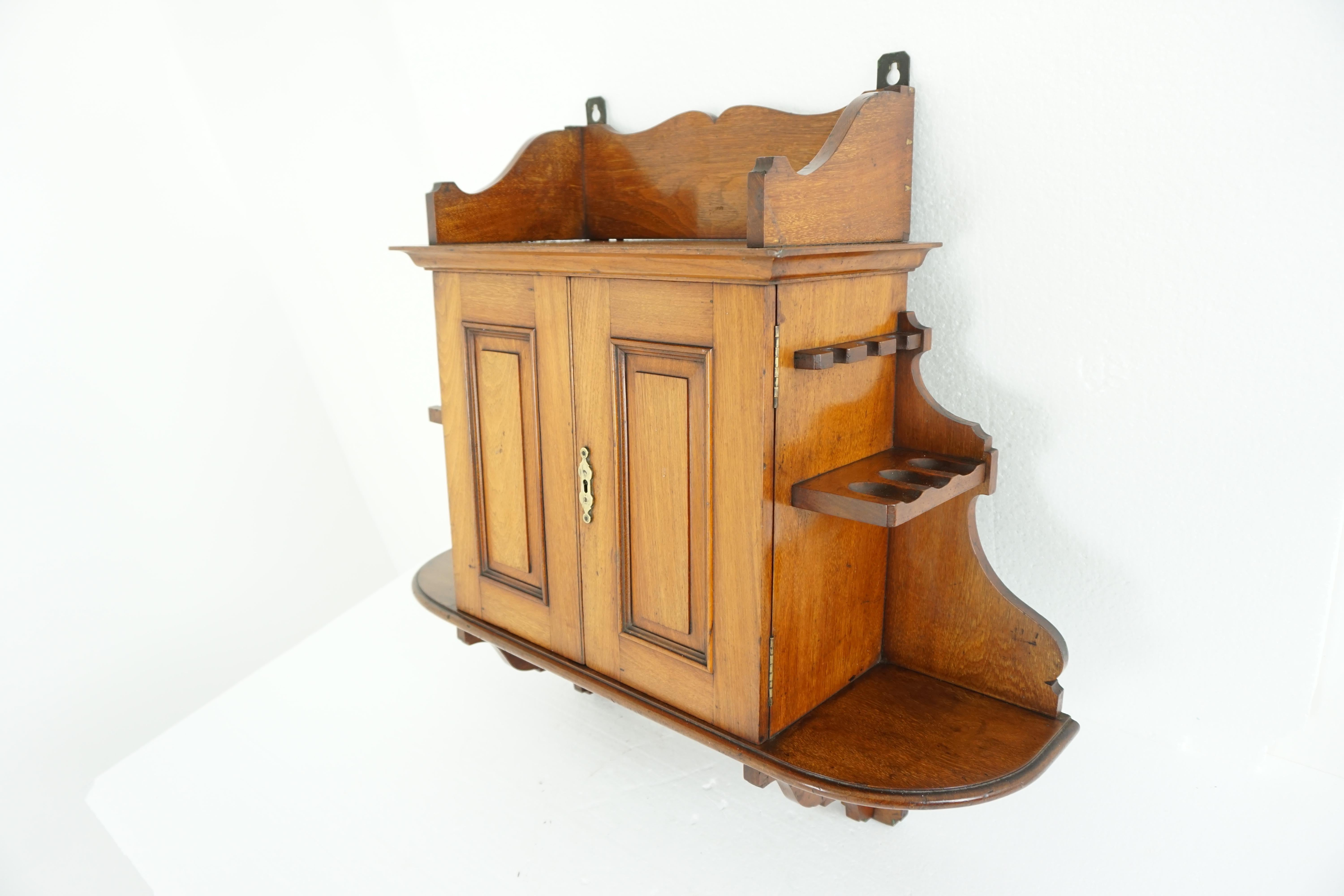 Antique walnut hanging smokers cabinet, wall cabinet, antique furniture, Scotland, 1890, 1889

Scotland

1890

Solid walnut
Original finish
Galleried top
Side racks for pipes
Pair of pencilled doors
Fitted with two short and two long