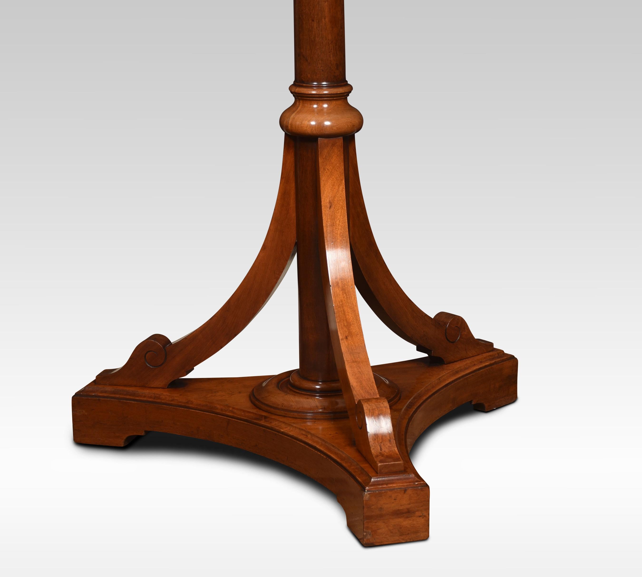 Walnut hat and coat stand with an acorn finial, rotating top section with eight brass hooks and four smaller hooks raised up on a circular column with a triform platform base.
Dimensions
Height 79 Inches
Width 32 Inches
Depth 32 Inches.
