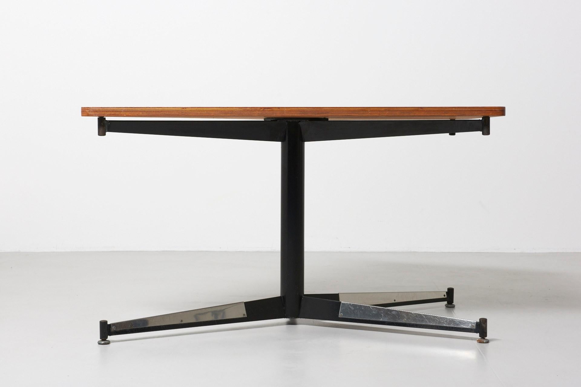A table designed by Willy Van Der Meeren for the HBK Bank Building in Antwerp. The diamond shaped tabletop is multiplex with walnut veneer, and supported by a black lacquered frame with folded sheets of steel.
The tables were produced in the 1960s