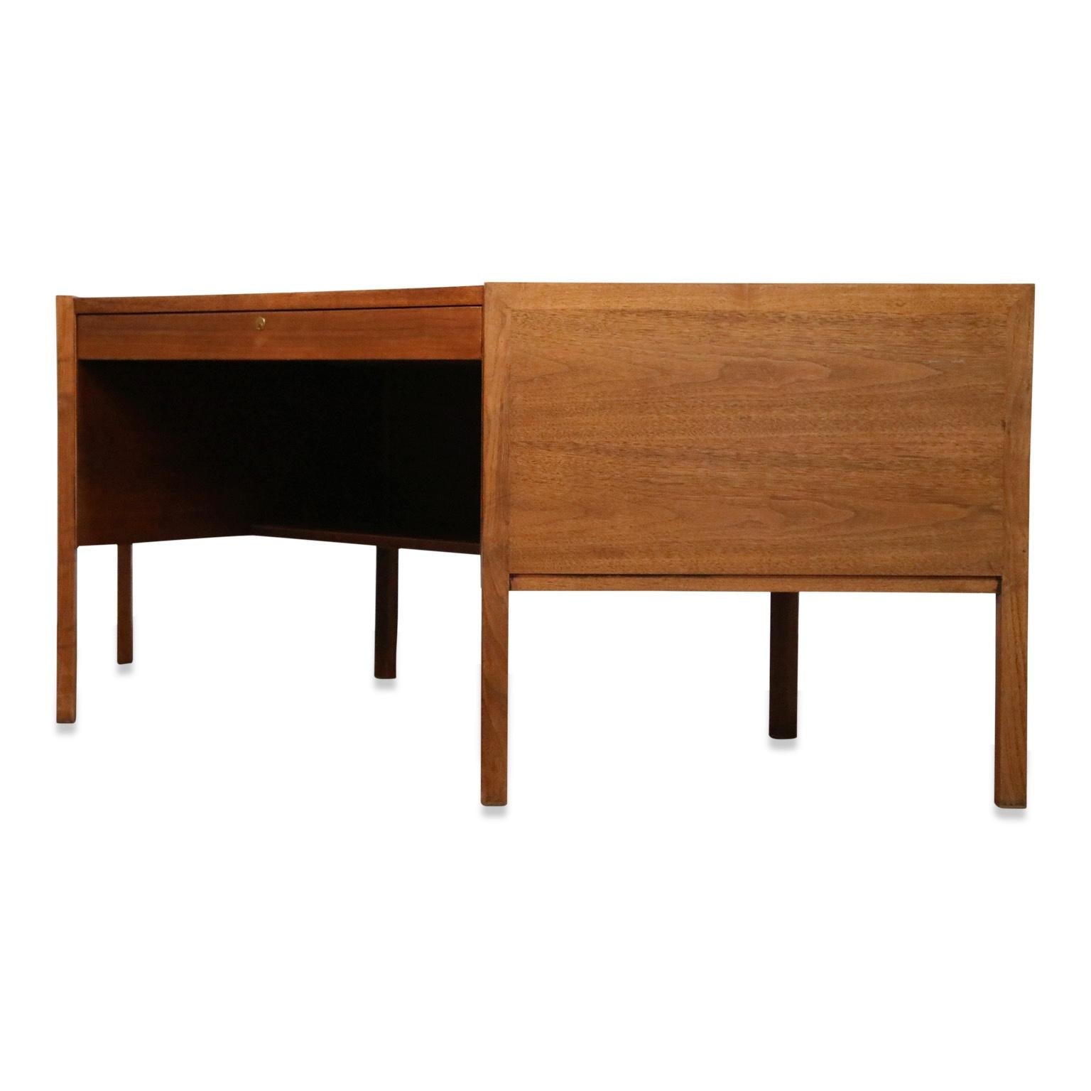 A stylish and classy Mid-Century Modern hexagonal desk by Edward Wormley for Dunbar. This writing table, made from beautiful walnut wood, was designed and made in the 1960s and is signed with its original Dunbar tag location in the front drawer.