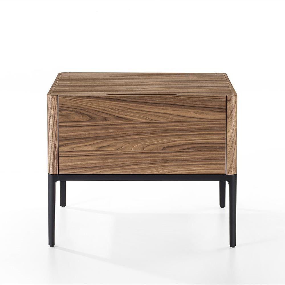 Nightstand walnut high drawer
with black lacquered aluminium base 
and with solid walnut structure with 1 
drawer.