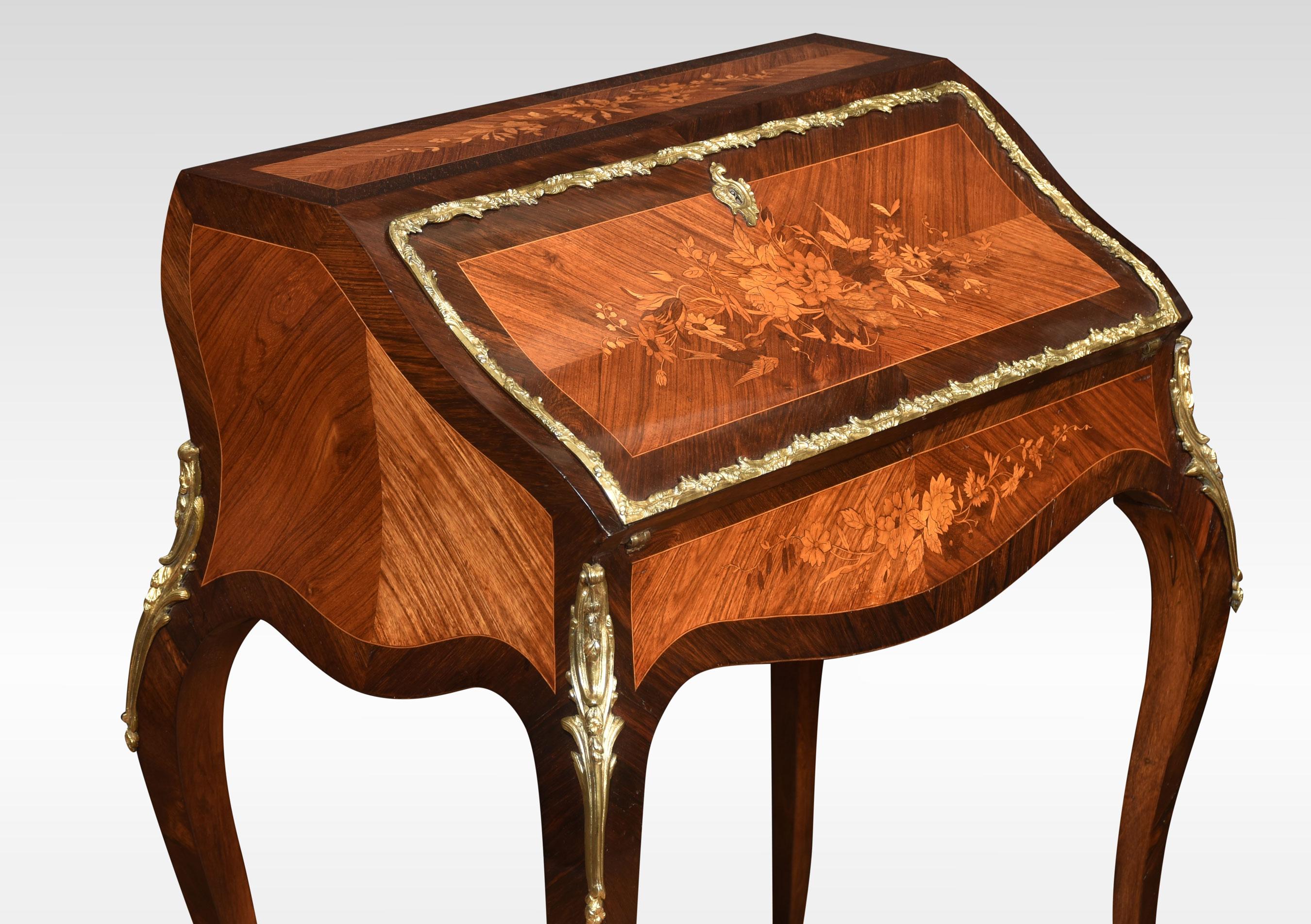 19th-century French gilt metal mounted walnut and marquetry bombe bureau de dame, in Louis XV style. The fall front encloses a fitted interior and inset writing surface. All raised up on four slender cabrioles brass mounted