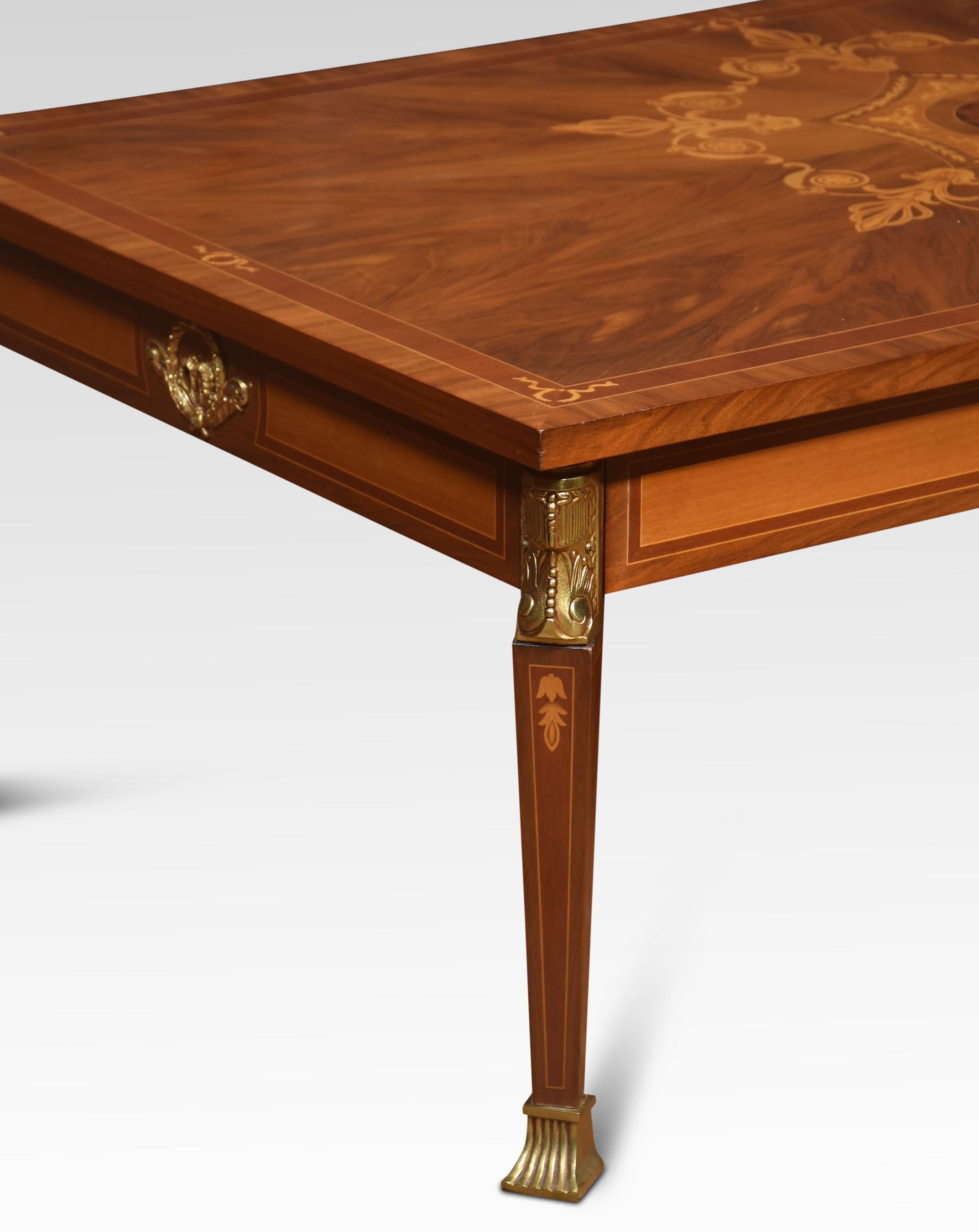 Walnut inlaid coffee table, the inlaid top with floral swag and string inlay. All raised on square tapering legs terminating in brass feet.
Dimensions
Height 19 Inches
Width 55.5 Inches
Depth 31.5 Inches