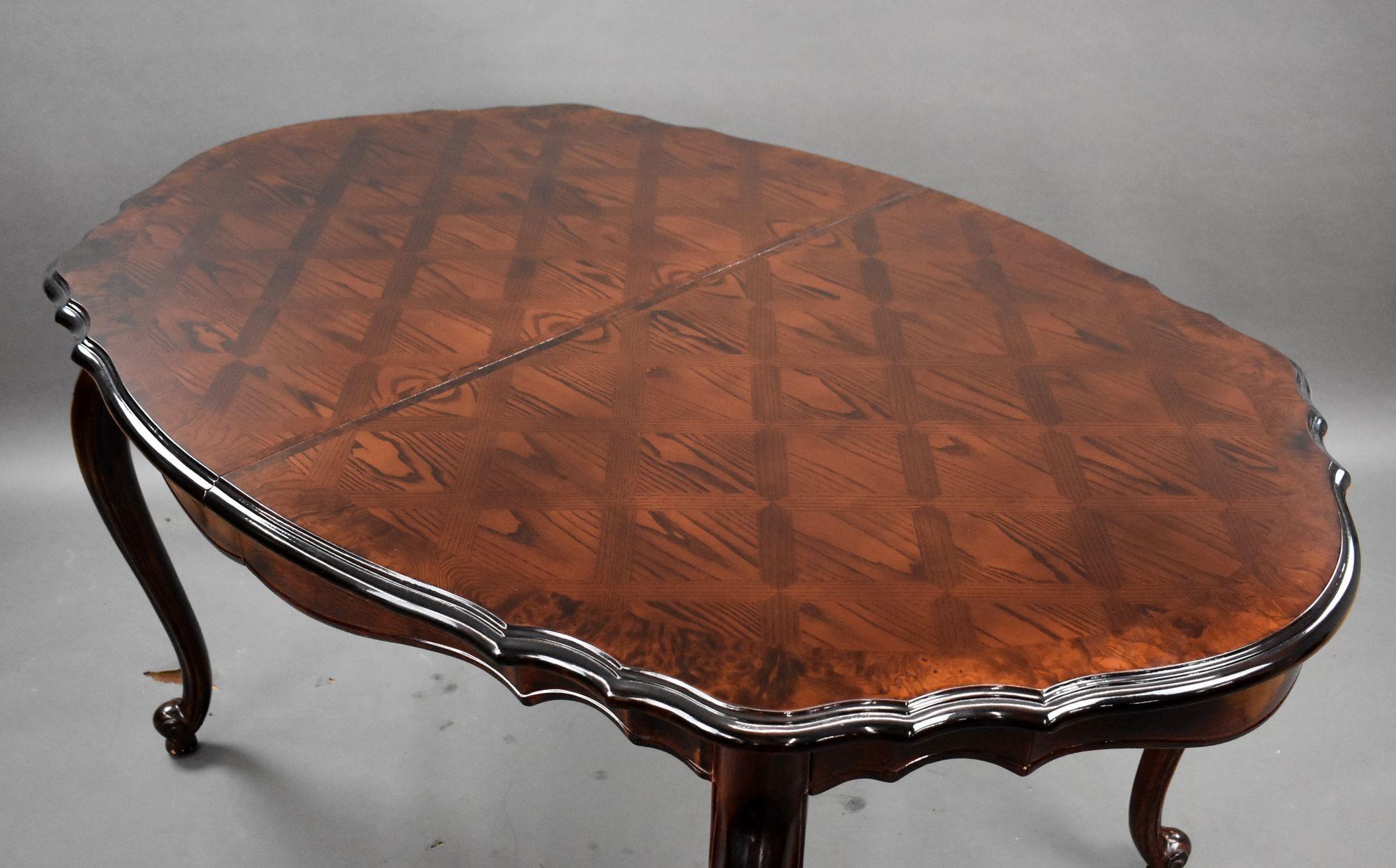 For sale is a walnut inlaid dining table, remaining in very good condition.

Width (extending): 239cm Width (closed): 163cm Depth: 107cm Height: 77cm