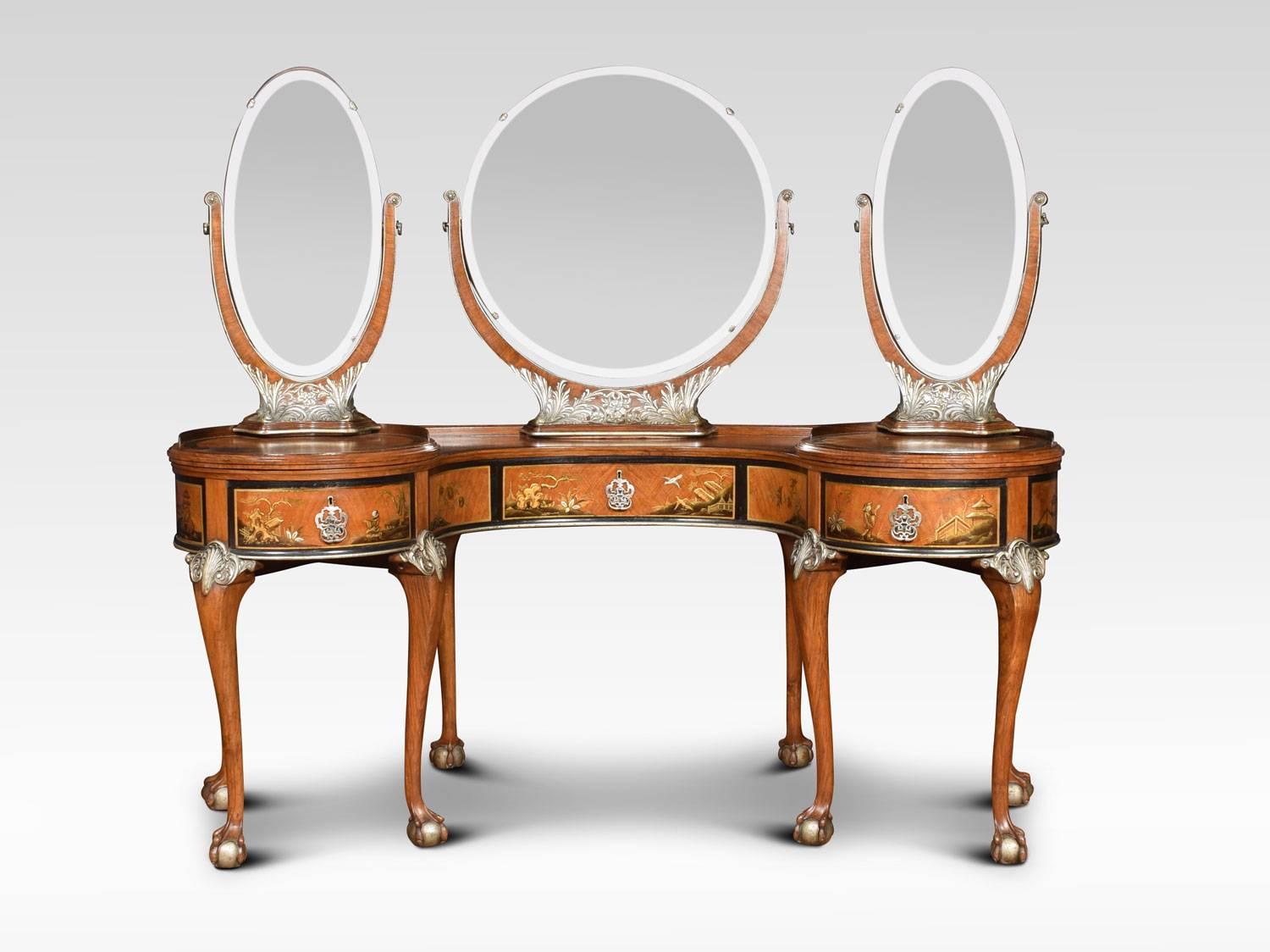 Walnut kidney shaped chinoiserie decorated dressing table. The large central circular beveled mirror raised up on ornate superstructure with silvered foliated base. Flanked by unusual side mirrors which have swivel action and can rotate fully. The