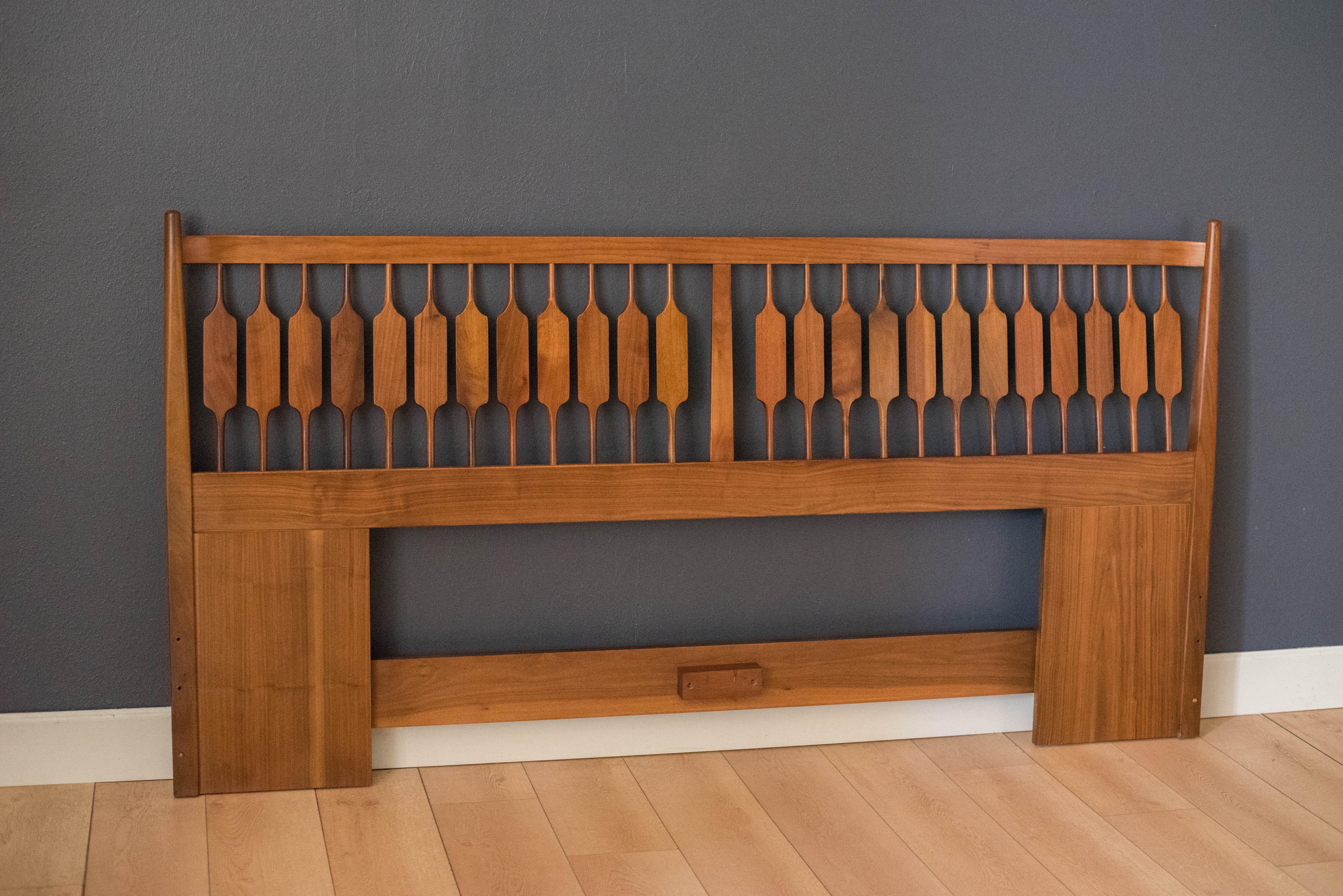 Mid century king headboard designed by Stewart McDougall & Kipp Stewart for Drexel Furniture Co. This piece displays the Declaration line's signature sculpted design in black walnut. Matching pair of nightstands available in separate listing.
