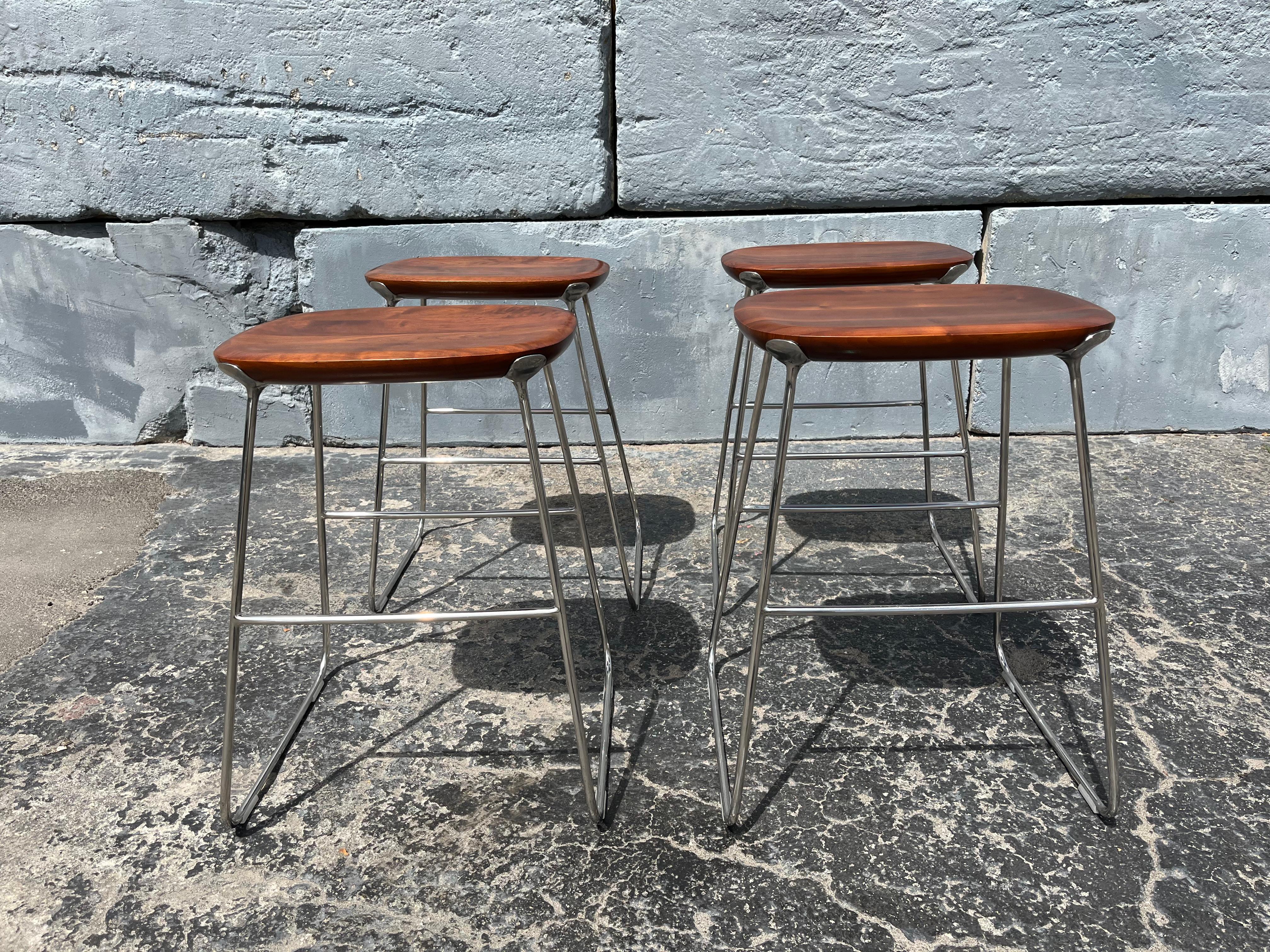 Laine Counter Stool by Defne Koz for Bernhardt Design, Walnut and Stainless Steel. Price is for one, four in total available. In the pictures stools may seem to be different height’s which is not the case, all are 24.5” in height.