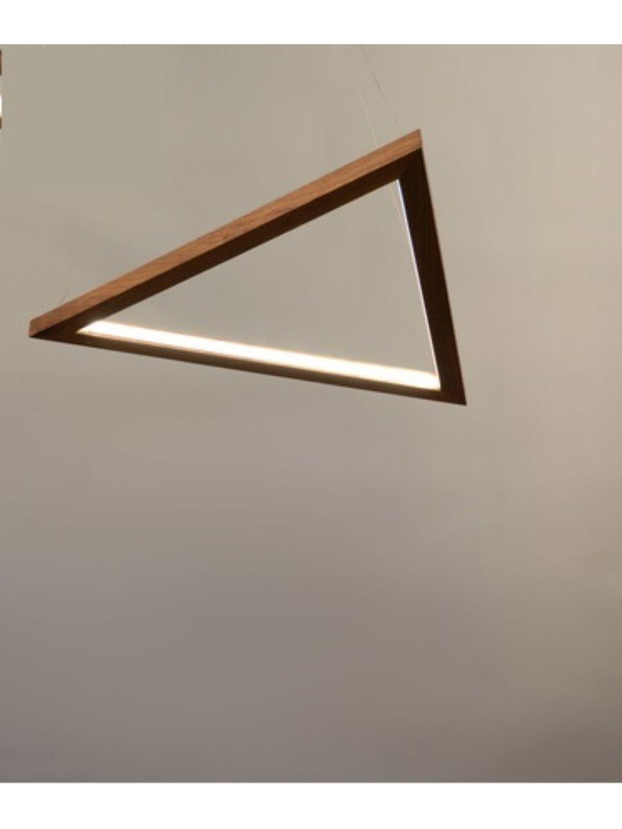 Walnut triangle sconce - pendant by Hollis & Morris
Dimensions: 25