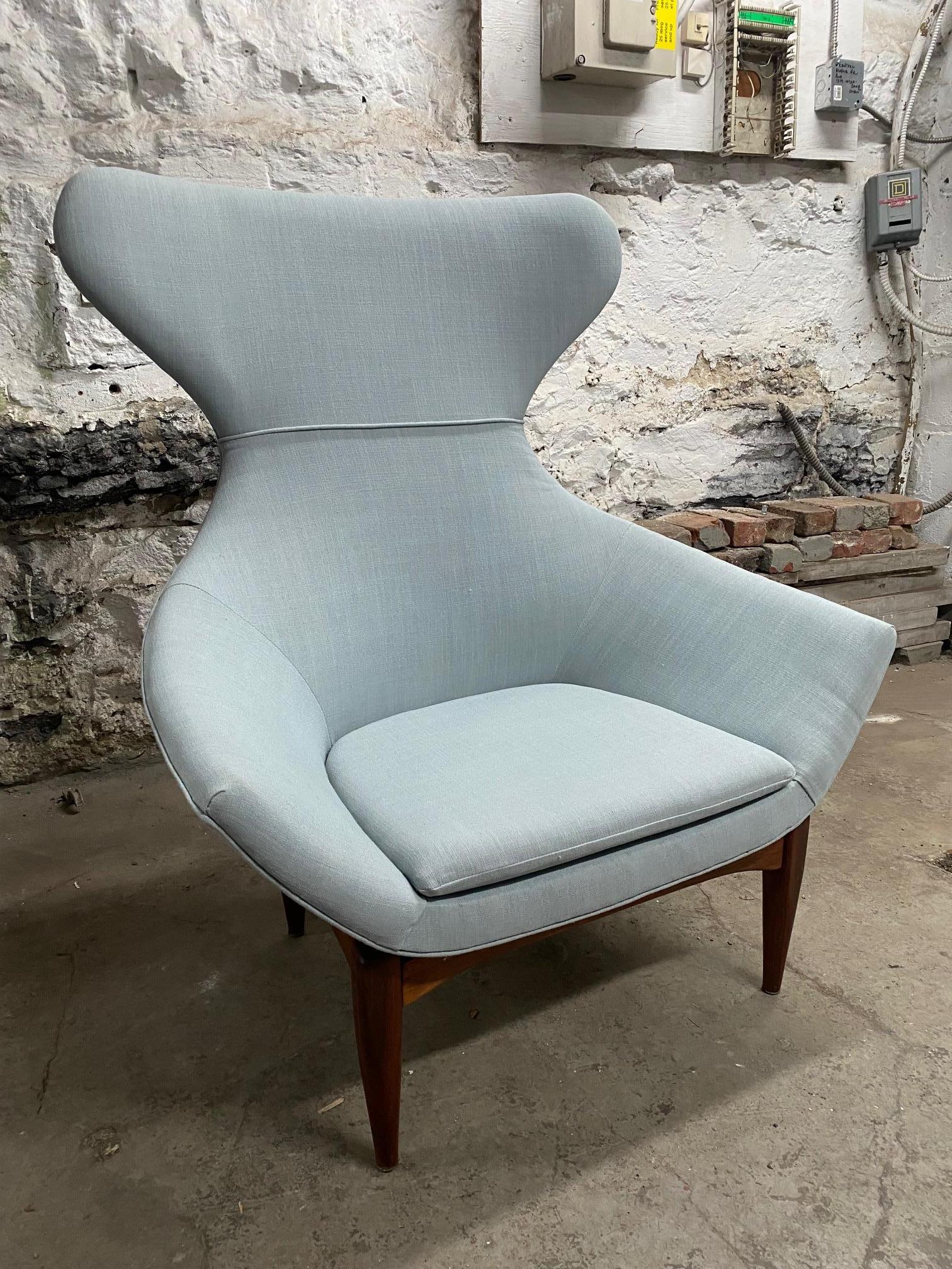 Walnut light blue linen wingback chair attributed to Adrian Pearsall.