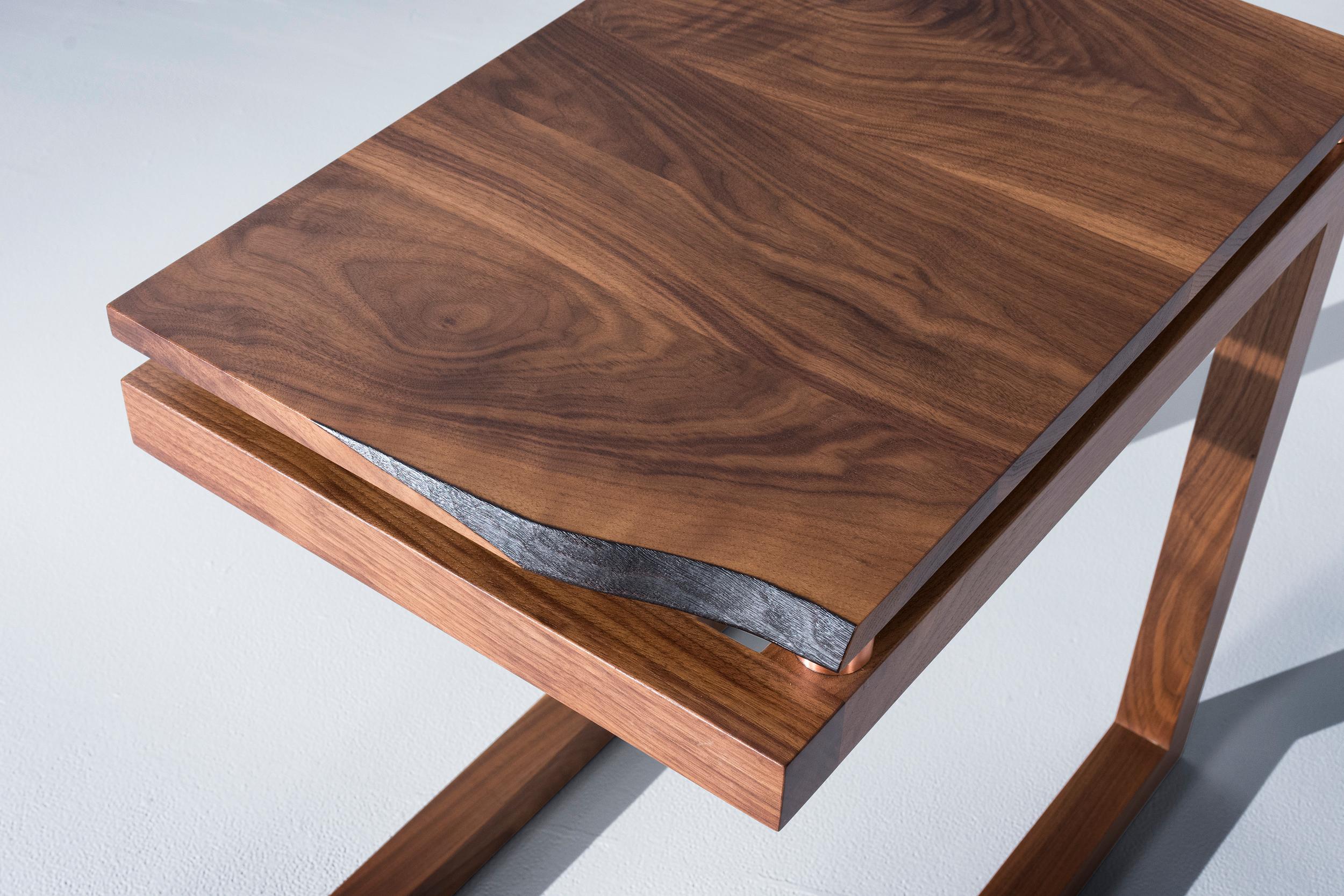 The Clairmount end tables have a walnut live edge board that is elevated using copper tubing to create a modern and organic look. The walnut base is made out of basic joinery to create a sharp modern look to the base of the end table. Pricing is per