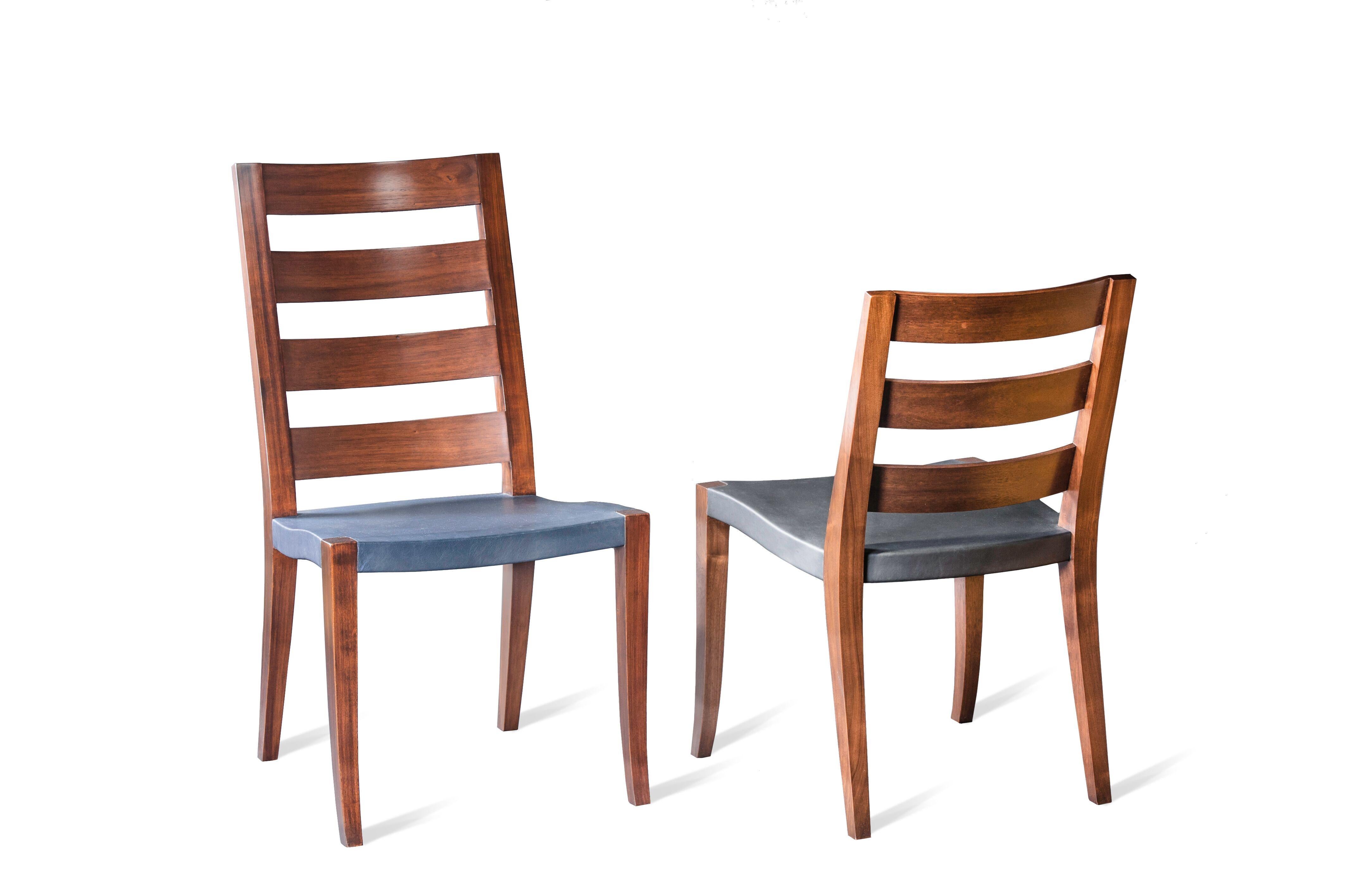 Walnut low and high slat back chairs with slung leather seat
Mortise and tenon construction. 
Comes in two heights 38.5