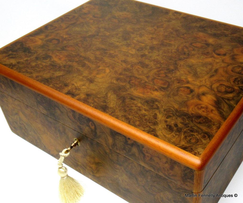 Stunning America walnut jewellery casket, manning of Ireland, Irish

This walnut jewellery casket was manufactured by the famed manning of Ireland company and is truly a jewel of handcrafted genius. This box is constructed of the finest woods