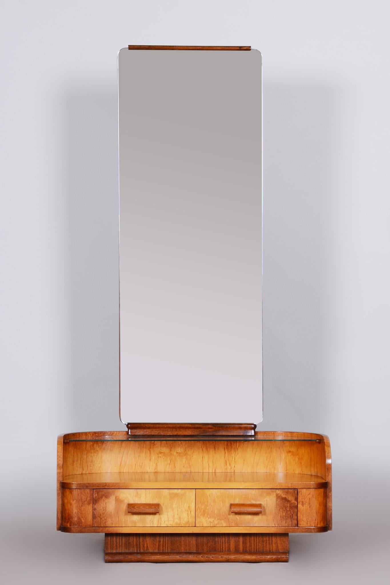 Art Deco mirror
Period: 1930 - 1939
Material: Combination of maple and walnut veneer.

Designed by Jindrich Halabala, renowned designer credited with ushering in the mass market production of furniture in his native Czechoslovakia. 

Made by