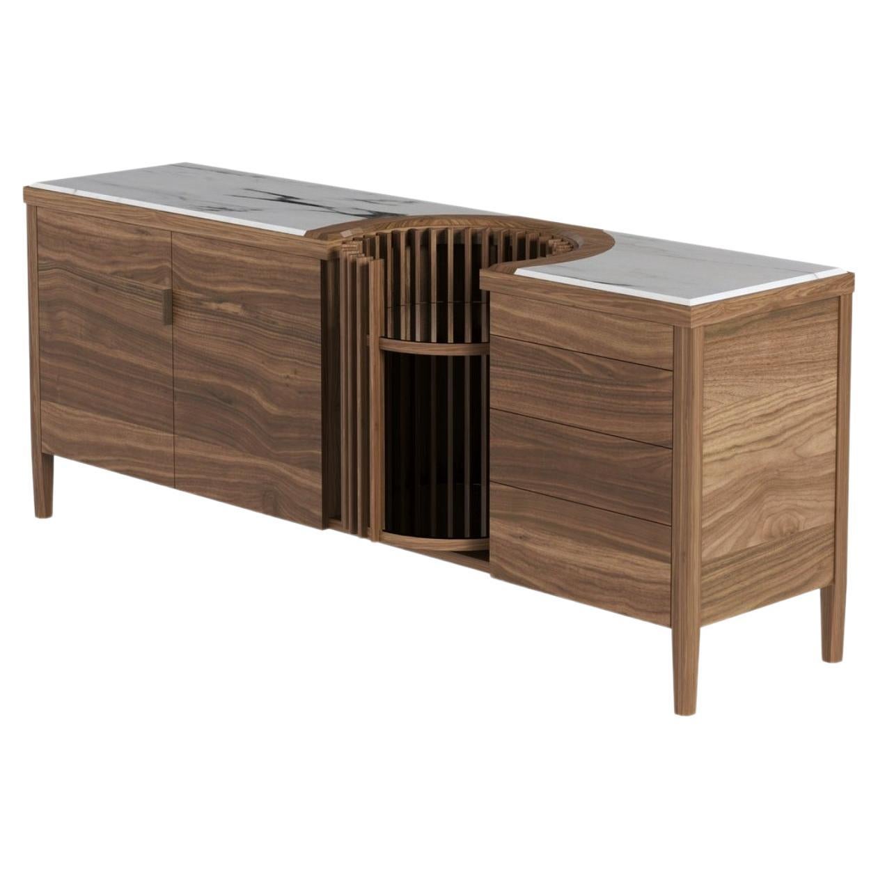 This beautiful solid walnut and marble top sideboard features two folding doors with internal wooden shelves and four drawers with tic-tac system, emphasizing the high quality of the materials and our skilled craftsmanship.

The focal point of the