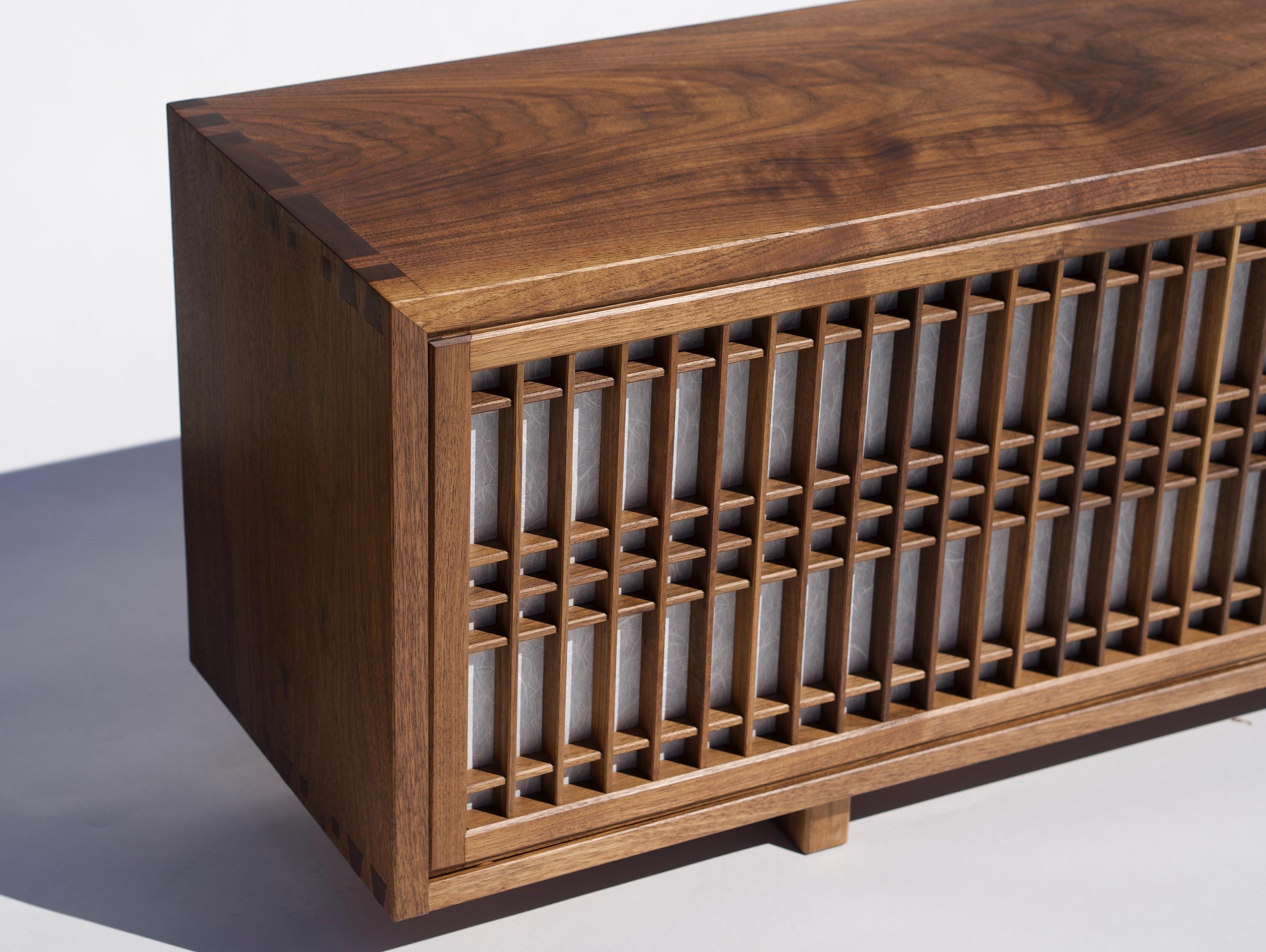 Walnut cabinet made by hand and featuring shoji doors and shelves. This cabinet is constructed utilizing time honored joinery techniques featured in Japanese temple carpentry in addition it features shoji made utilizing those same traditional