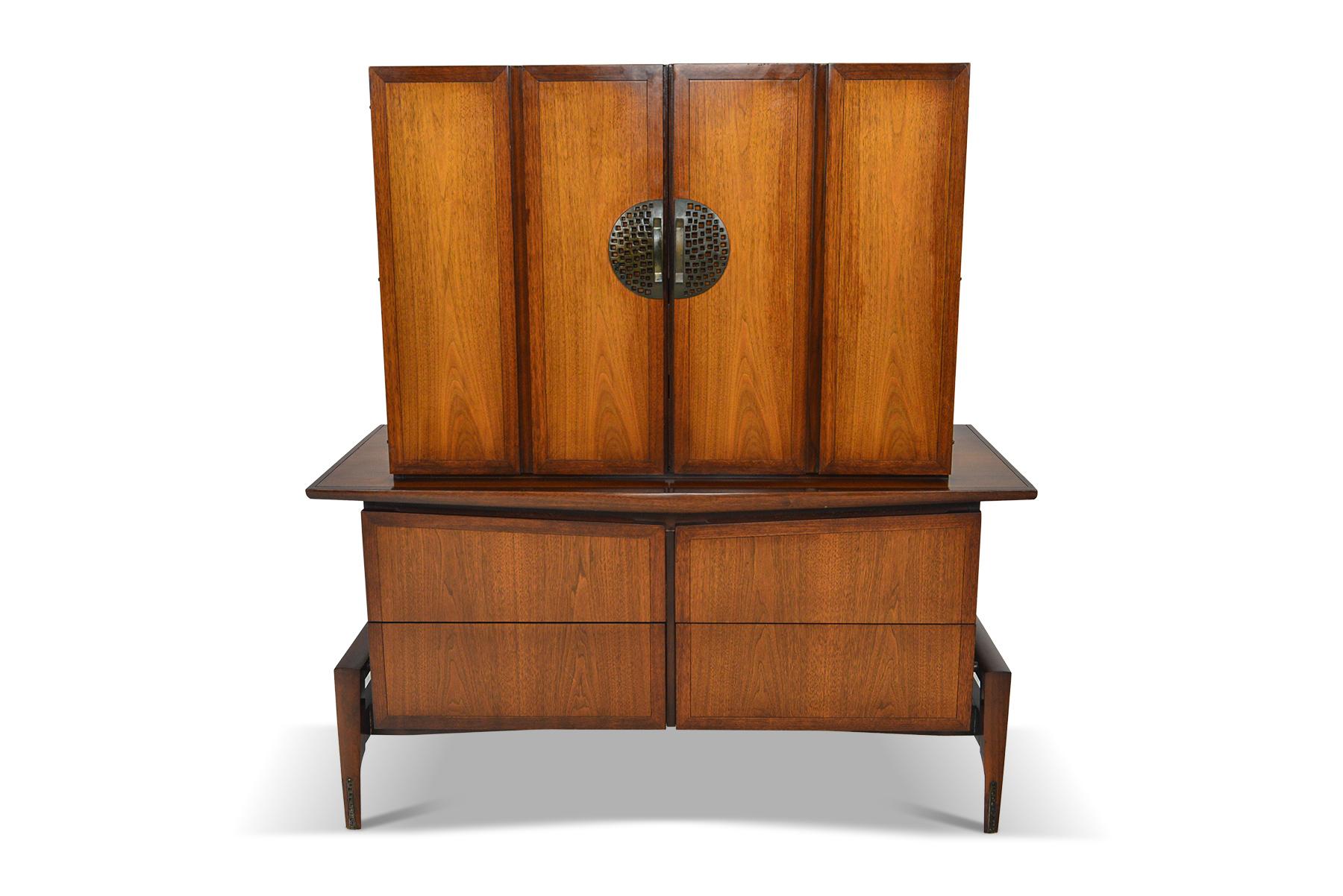This beautifully crafted walnut highboy dresser was designed by Helen Hobey Baker for Baker furniture in the late 1960s. In excellent original condition.

Measurements: 49 wide x 21 deep x 54 tall
Drawer: 33 wide x 15.5 deep x 4 tall.