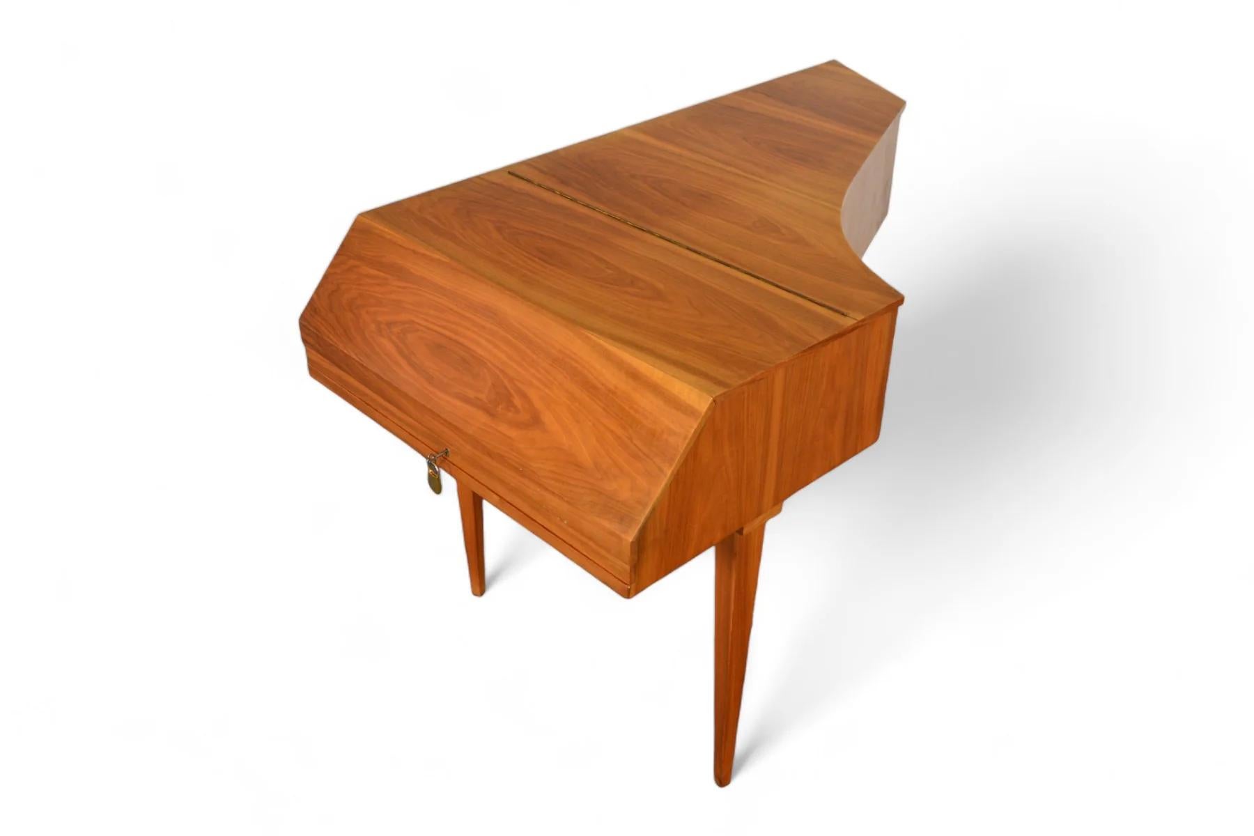 Origin: Germany
Designer: Johann Christoph Neupert
Manufacturer: Neupert
Era: 1960s
Materials: Walnut, Ebony
Measurements: 50.25