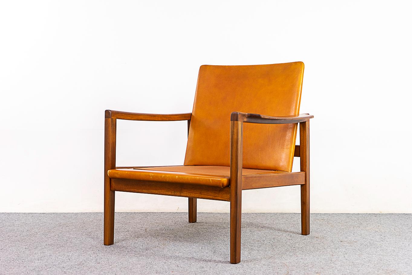 Walnut Danish lounge chair, circa 1960's. Beautifully sculpted frame with smooth joinery and a stunning silhouette. Solid wood frame and leather have been refinished. Seat & back cushions not included, customize upholstery on your end to suit the