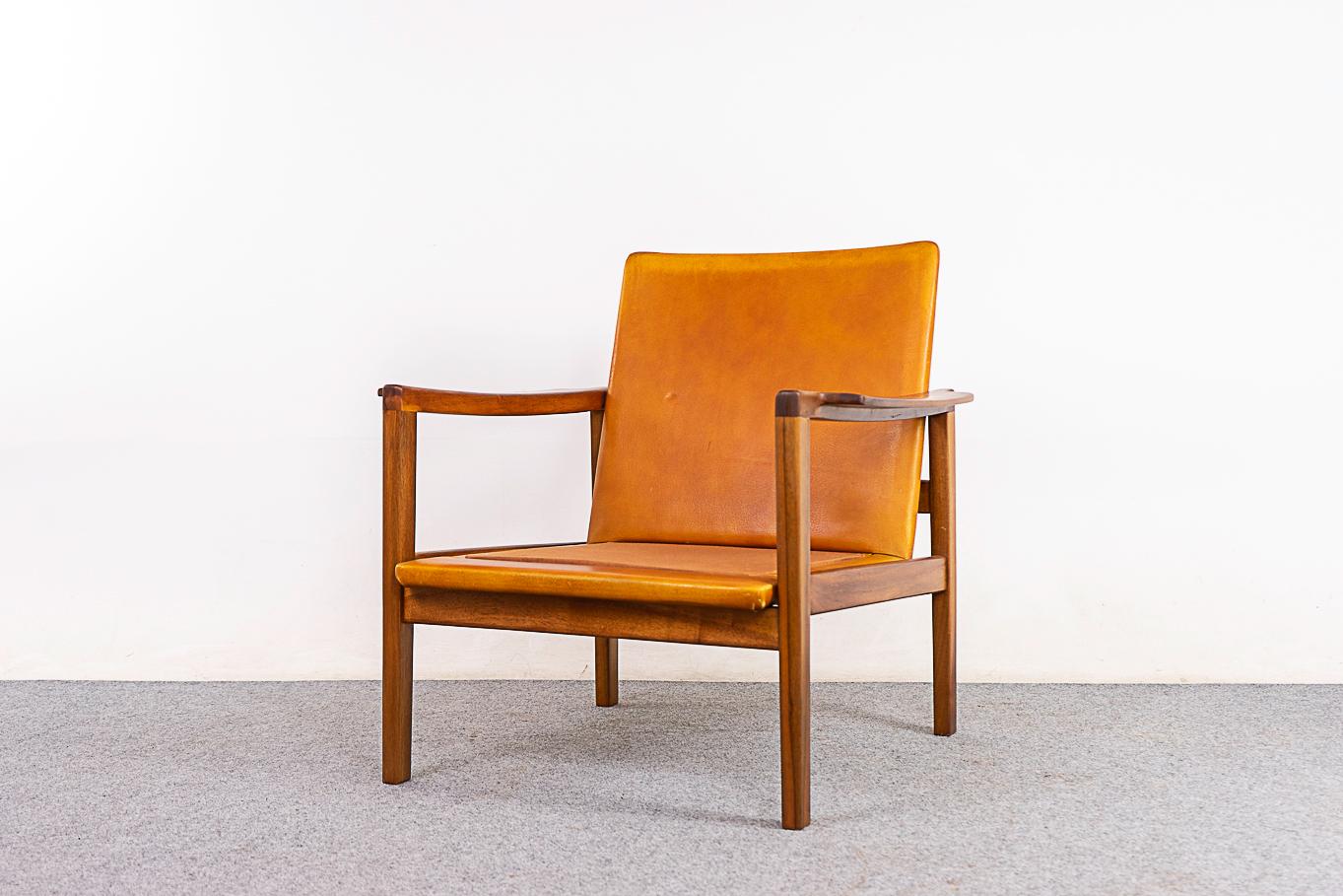 Walnut Danish lounge chair, circa 1960's. Beautifully sculpted frame with smooth joinery and a stunning silhouette. Solid wood frame and leather have been refinished. Seat & back cushions not included, customize upholstery on your end to suit the