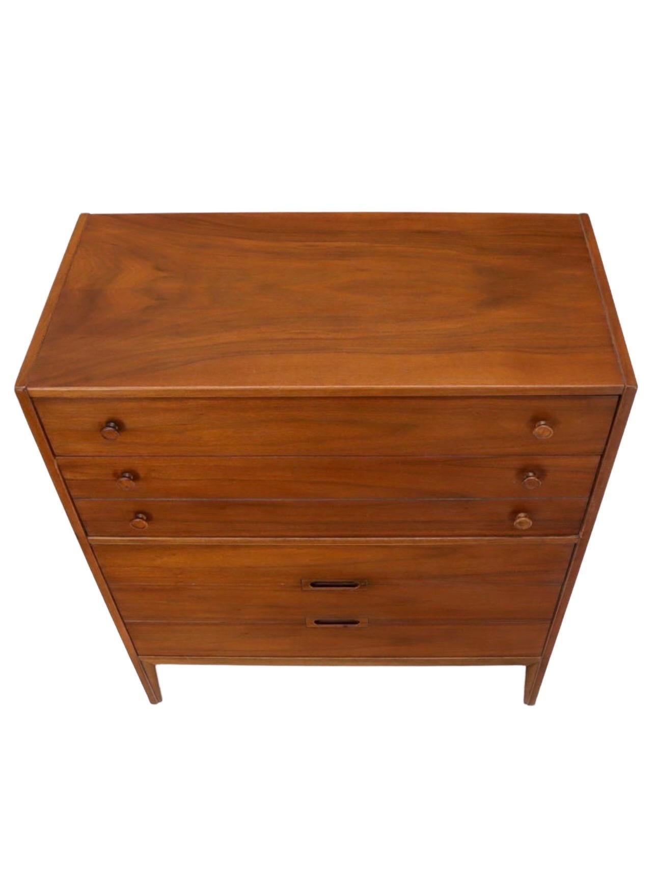 Mid-Century Modern walnut high chest of drawers. High quality craftsmanship and walnut wood selection along with solid oak interior.