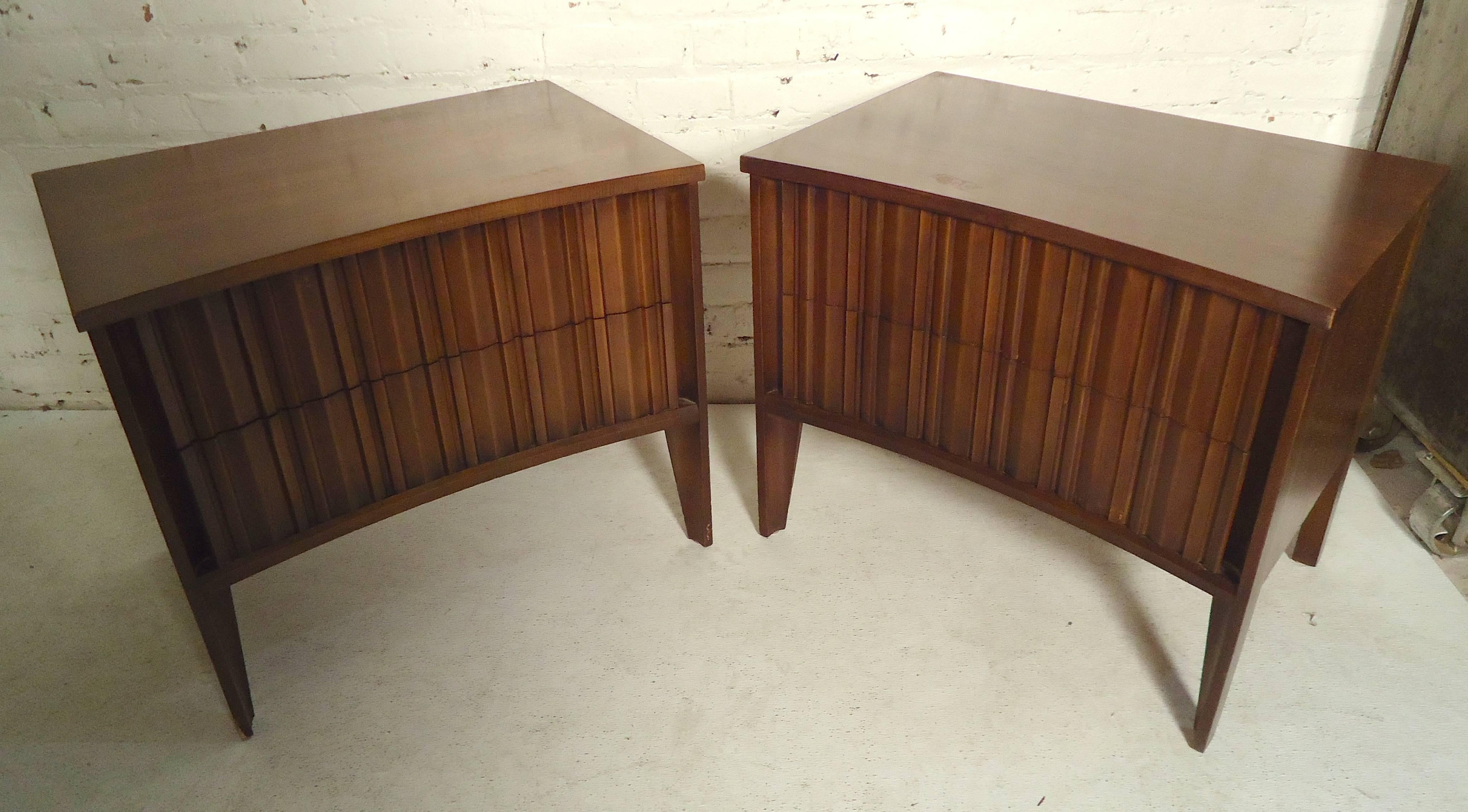 Unique side tables with a curved front and sculpted pattern. Two drawers and tapered legs.

(Please confirm item location - NY or NJ - with dealer).
    