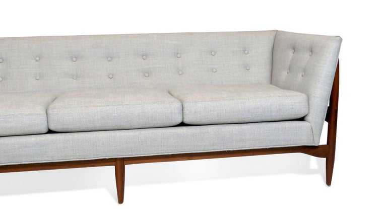 Milo Baughman for Thayer Coggin Walnut frame sofa original designed in 1963, newly upholstered in an off-white fabric with button tufted backrest and three seat cushions. Floor model as shown available for immediate shipping
 
COM custom orders