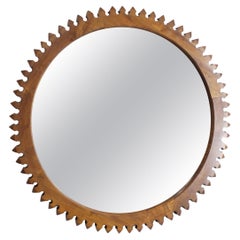 Walnut mirror with prismatic melon profile - c. 1965