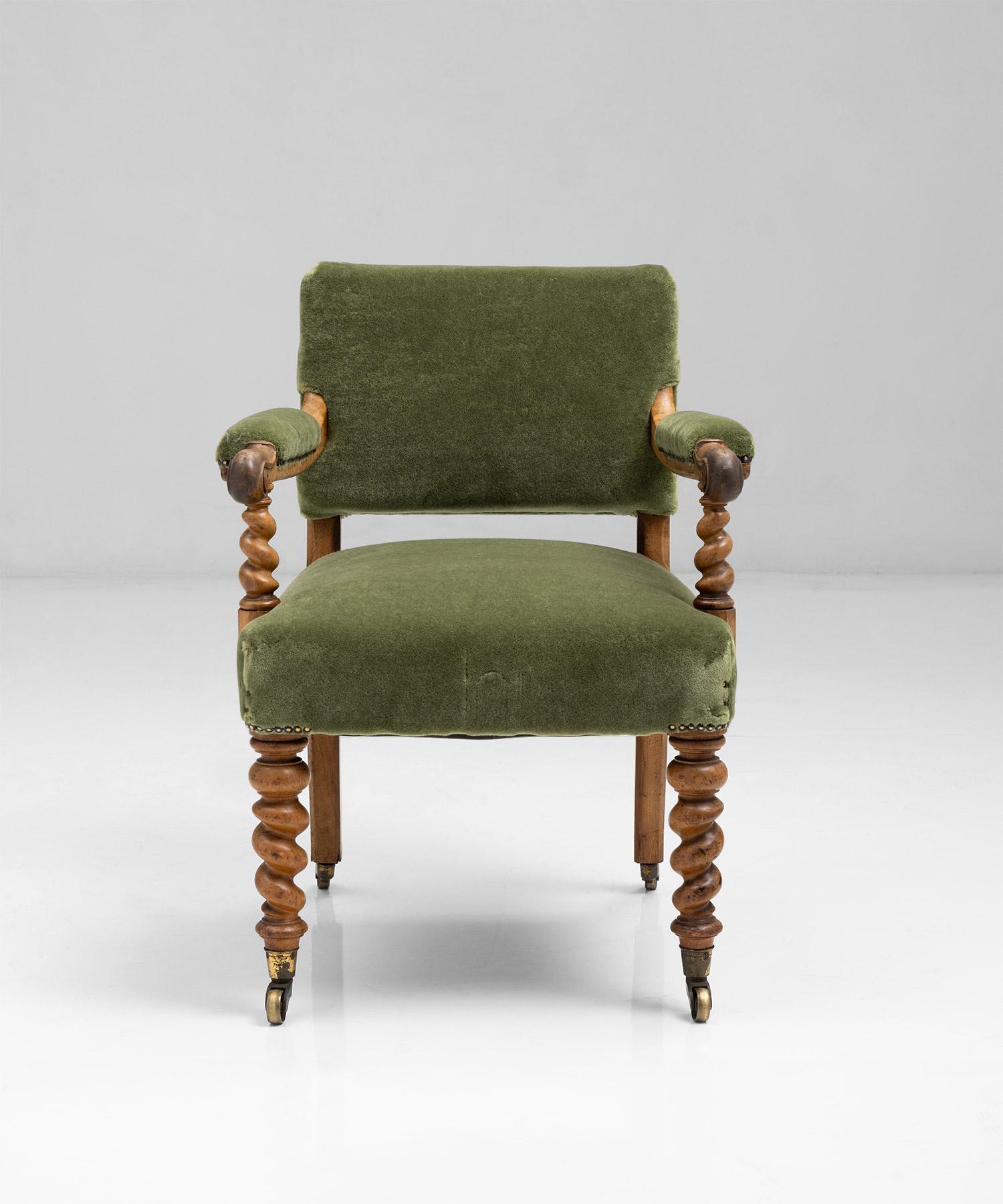 Newly upholstered in Pierre Frey mohair velvet, with walnut barley twist frame and original gilt brass Cope & Collinson castors. Makers name and address “Hindley & Sons, Oxford Street, London, stamped to the rear”.
