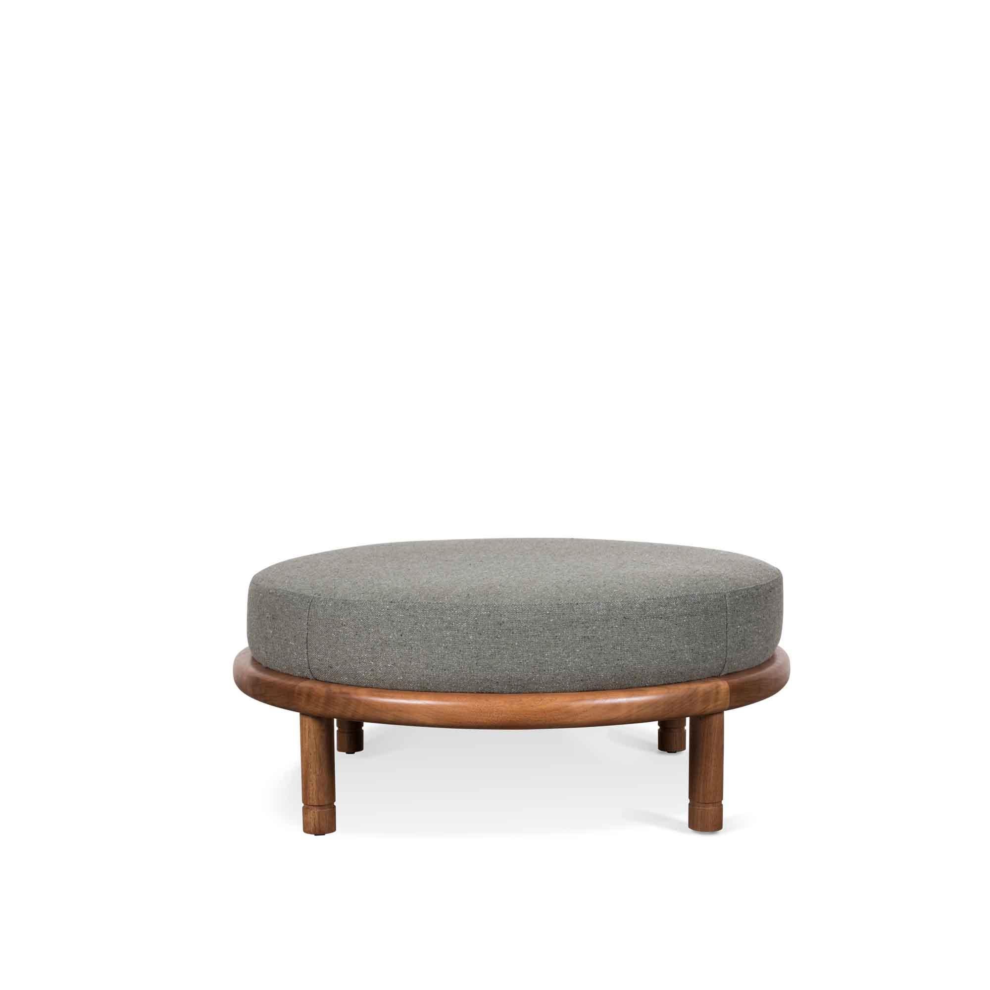 Walnut Moreno ottoman by Lawson-Fenning. The Moreno Ottoman features a round solid wood base with four cylindrical legs and an upholstered top. Available in American walnut or white oak. 

 