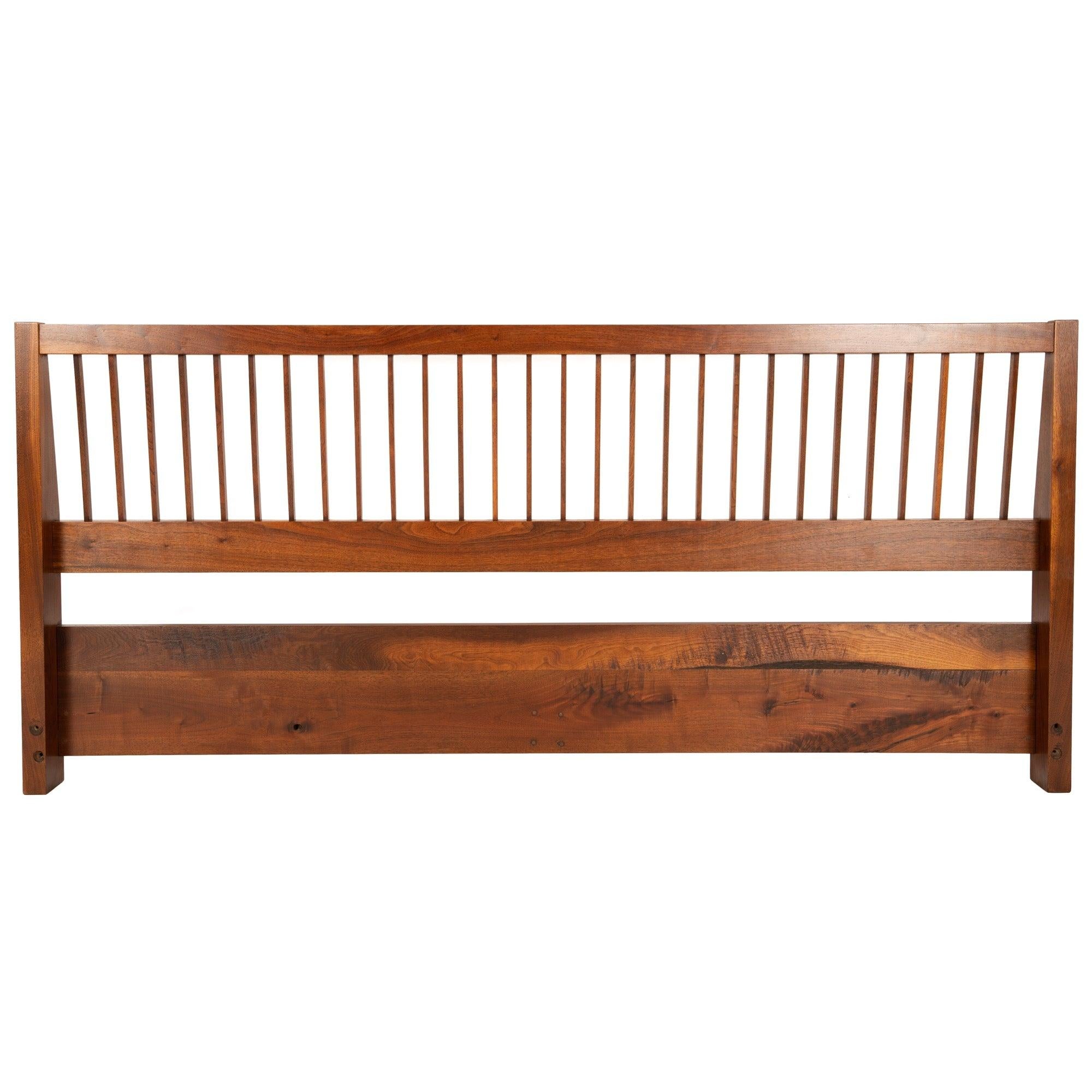 A king sized solid walnut headboard. Superb craftsmanship and beautifully executed design.