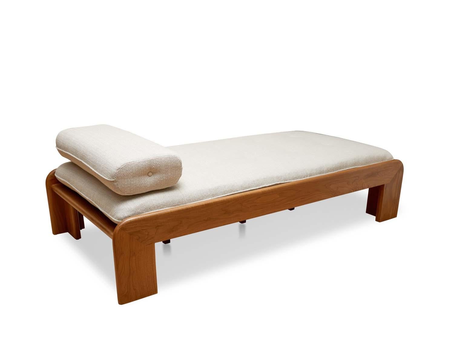 Walnut Topa Daybed by Lawson-Fenning. The Topa daybed features a roundover frame handcrafted in walnut or oak. The daybed is tufted and comes with a loose bolster pillow. 

The Lawson-Fenning Collection is designed and handmade in Los Angeles,
