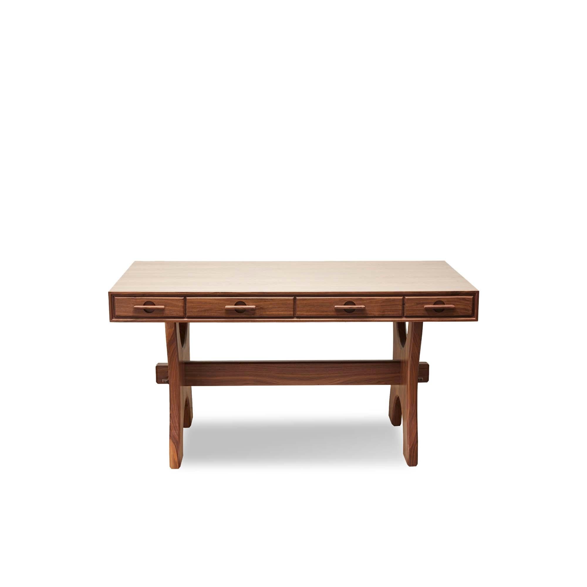 The Ojai desk has four drawers and features solid American walnut or white oak trestle legs. The drawer handles are made of solid carved wood. Shown here in Natural Walnut. 

The Lawson-Fenning Collection is designed and handmade in Los Angeles,