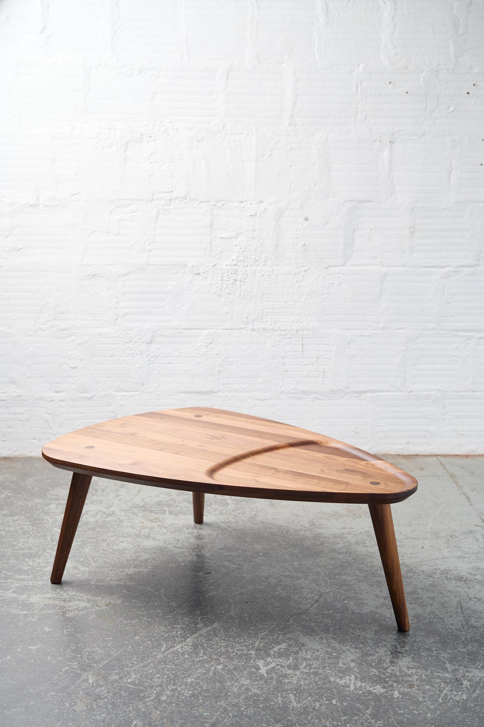 Walnut Oxbend Coffee Table by Fernweh Woodworking
Dimensions: Side A 127 x Side B 122 x Side C 89 x H 47 cm.
Materials: Walnut.

Available in charcoal ash and white ash. Also available in 40.5 cm height. Please contact us.

Justin Nelson
He is a