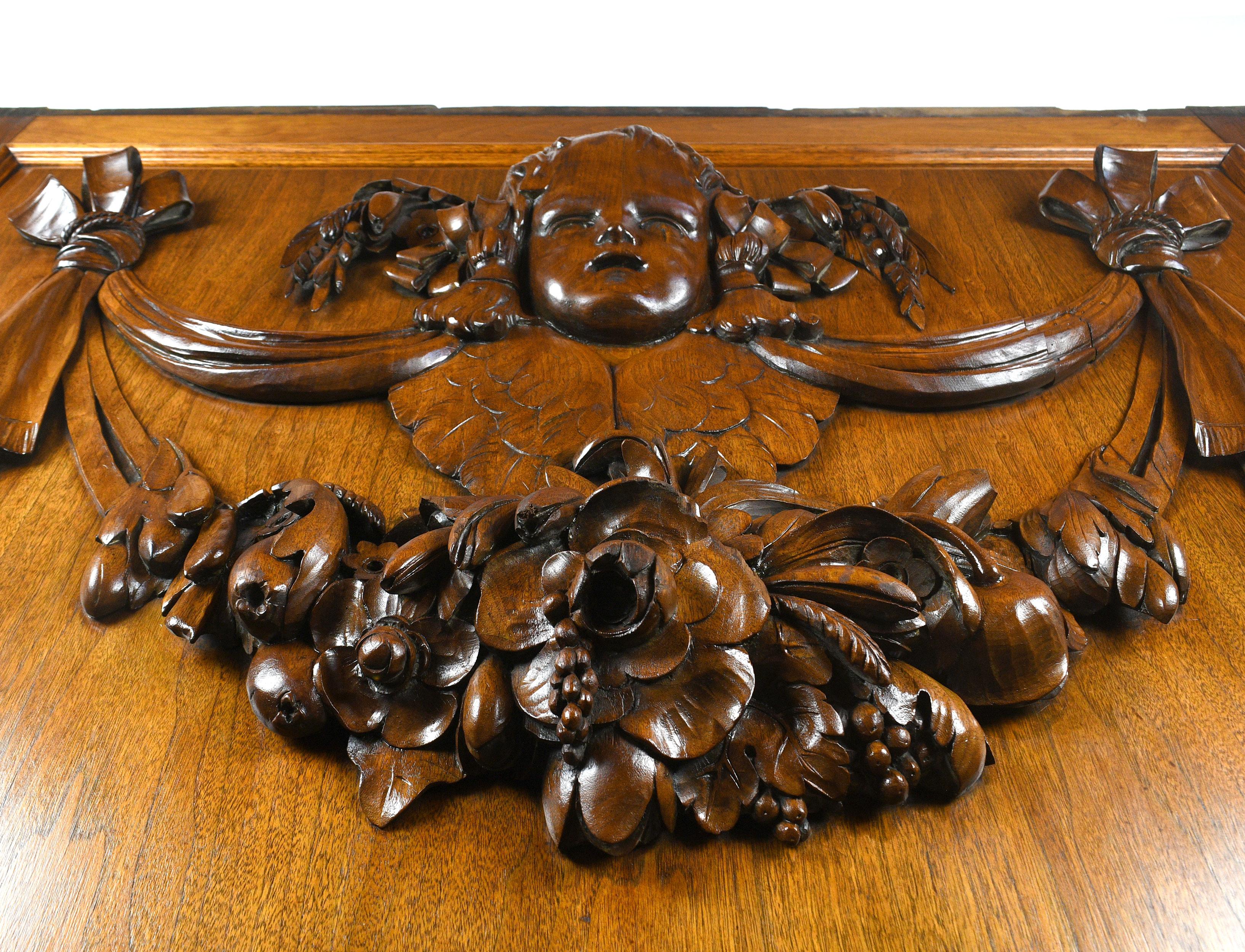 Salvaged from the original public ledger building in Philadelphia and in storage for years, these gorgeous wood panels are seeing light of day once again. This pair of hand carved wood panels is made of handsome walnut and features an intricately
