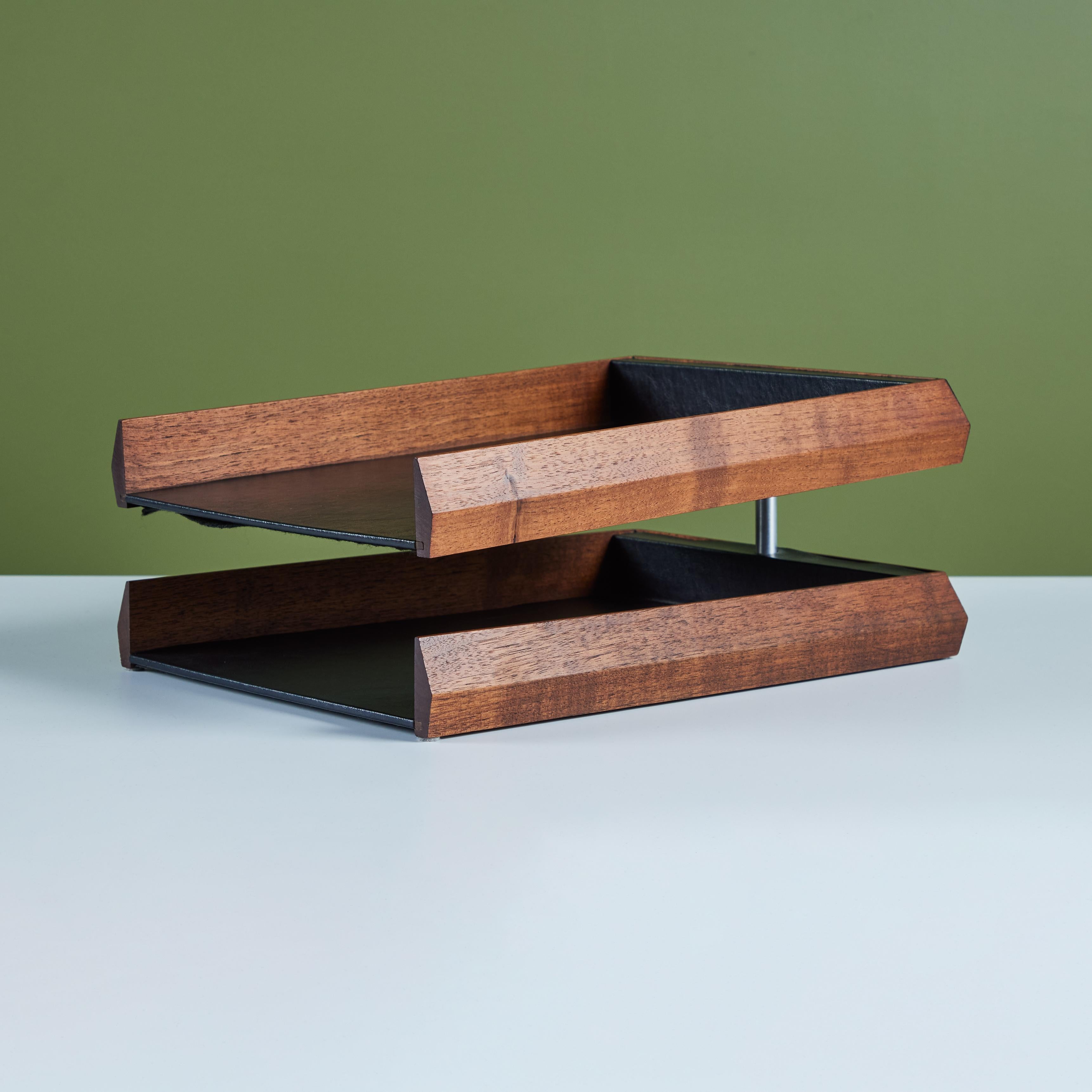 Walnut and naugahyde paper tray. The tray features dual black naugahyde lined trays, with oiled walnut cases and a stainless steel pin supporting the upper tier.

Dimensions: 
11