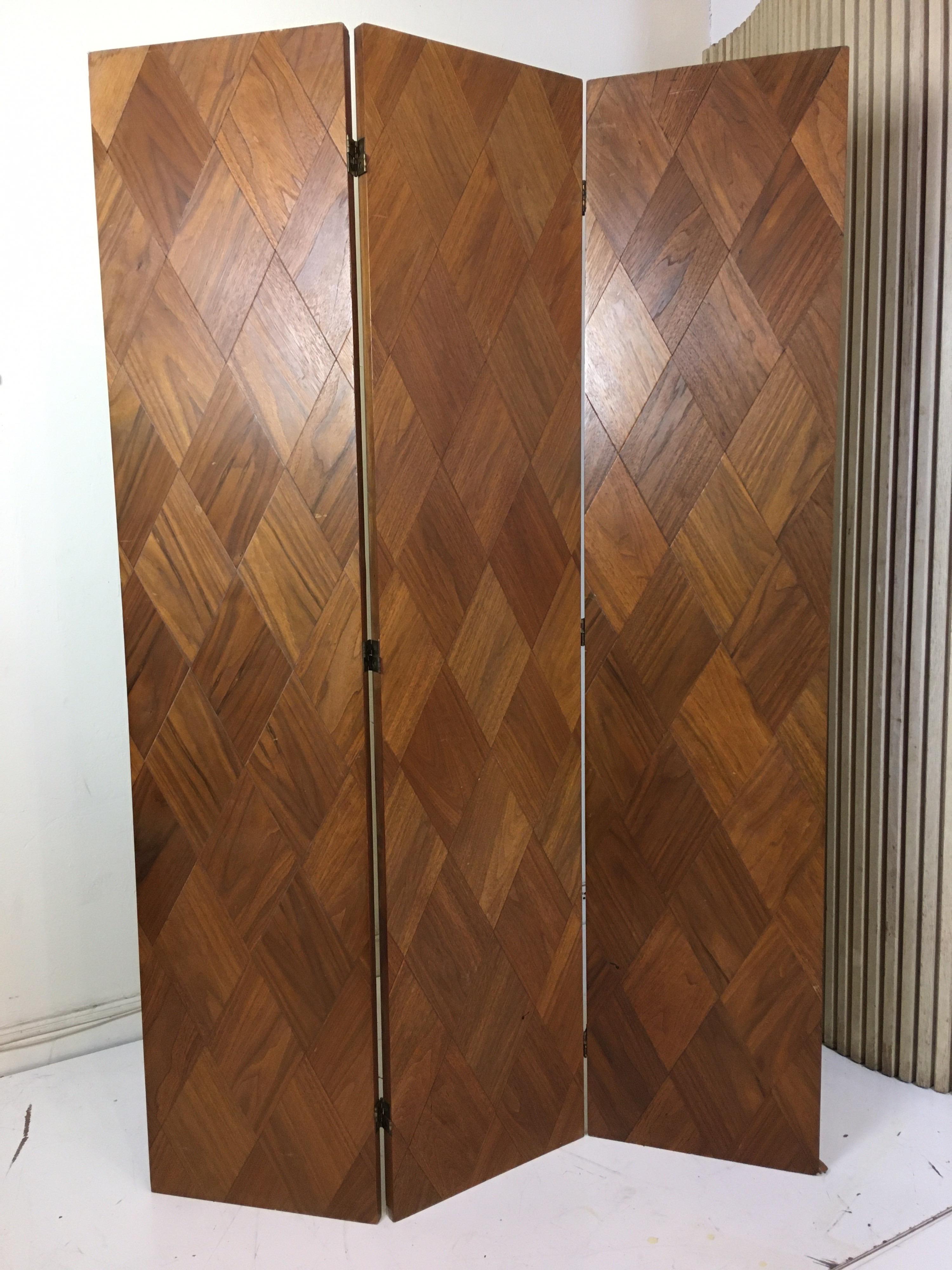 Walnut parquet 3-panel screen, Diamond shaped pieces of walnut cover both sides of all 3 sections. Folds flat for easy transporting. Each panel measures 15.75 wide and screen is just under 72