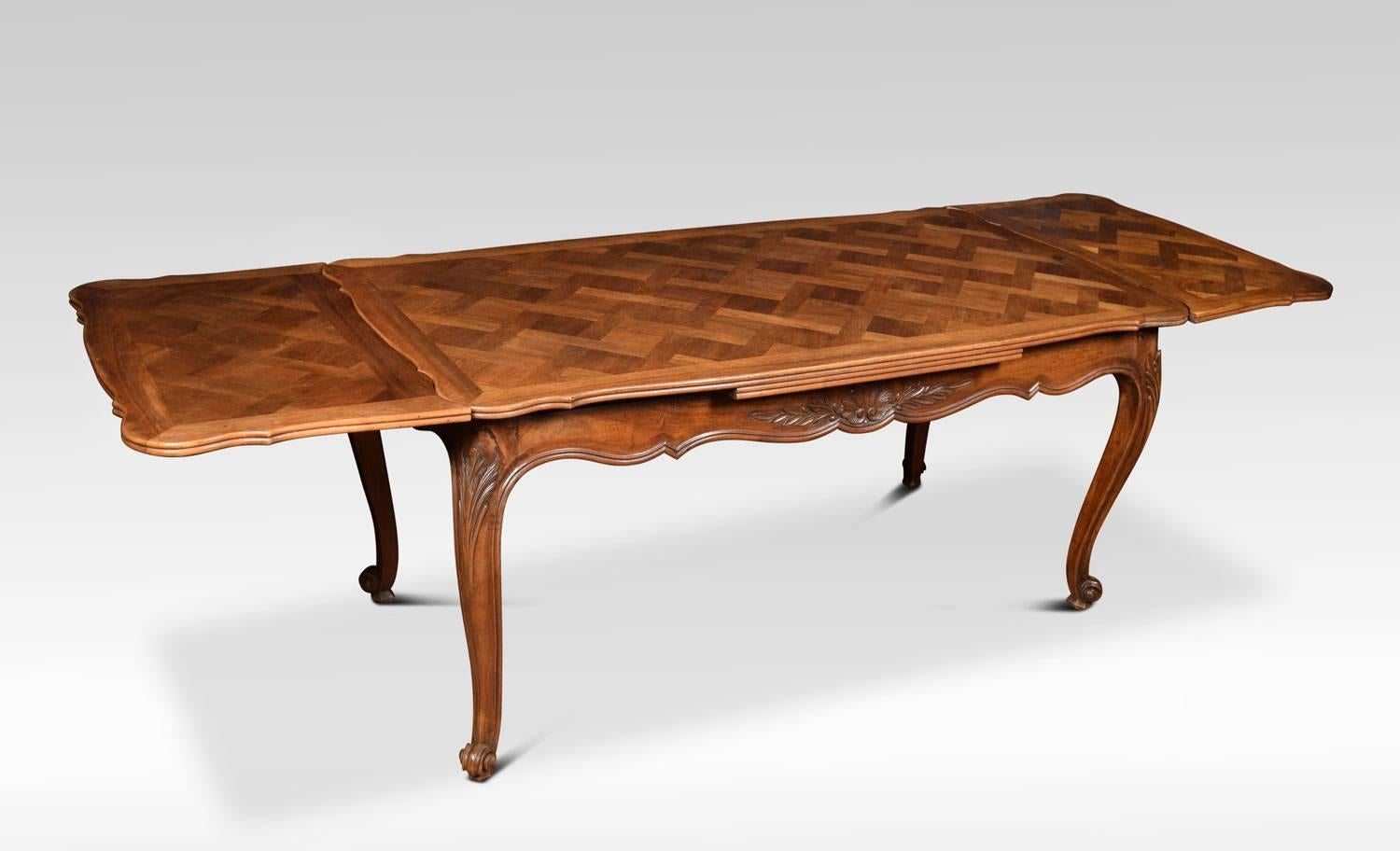 French Provincial style draw-leaf dining table, the serpentine walnut parquet top with two pull-out leaves above shaped carved apron. All raised up on cabriole legs terminating on upswept feet.
Dimensions:
Height 30.5 inches
Length 67 inches when