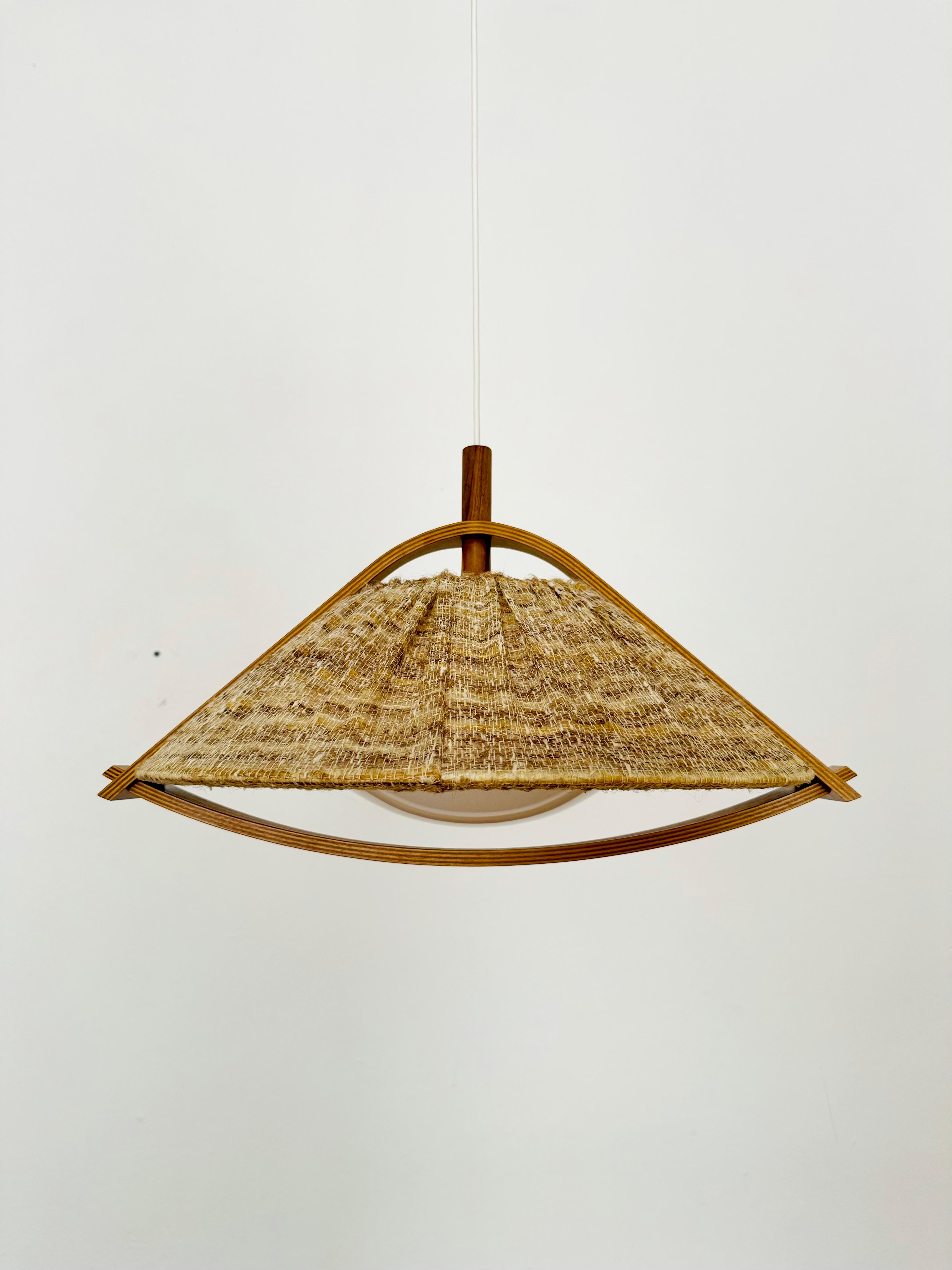 Exceptionally beautiful and large pendant lamp from the 1960s.
The design is very unusual.
The shape and materials create a warm and very pleasant light.

Condition:

Very good vintage condition with slight signs of age-related wear.
The lampshade