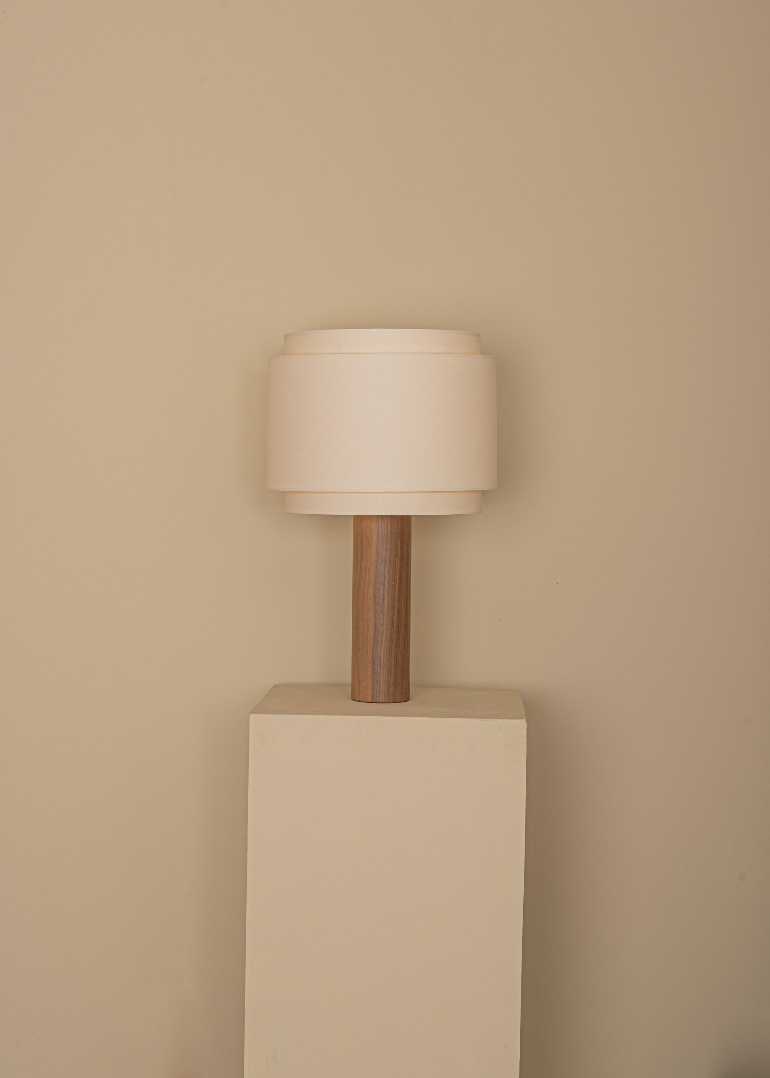 Walnut Pipo Duoble Table Lamp by Simone & Marcel
Dimensions: D 35 x W 35 x H 60 cm.
Materials: Cotton and walnut.

Also available in different marble and wood options and finishes. Custom options available on request. Please contact us. 

All our