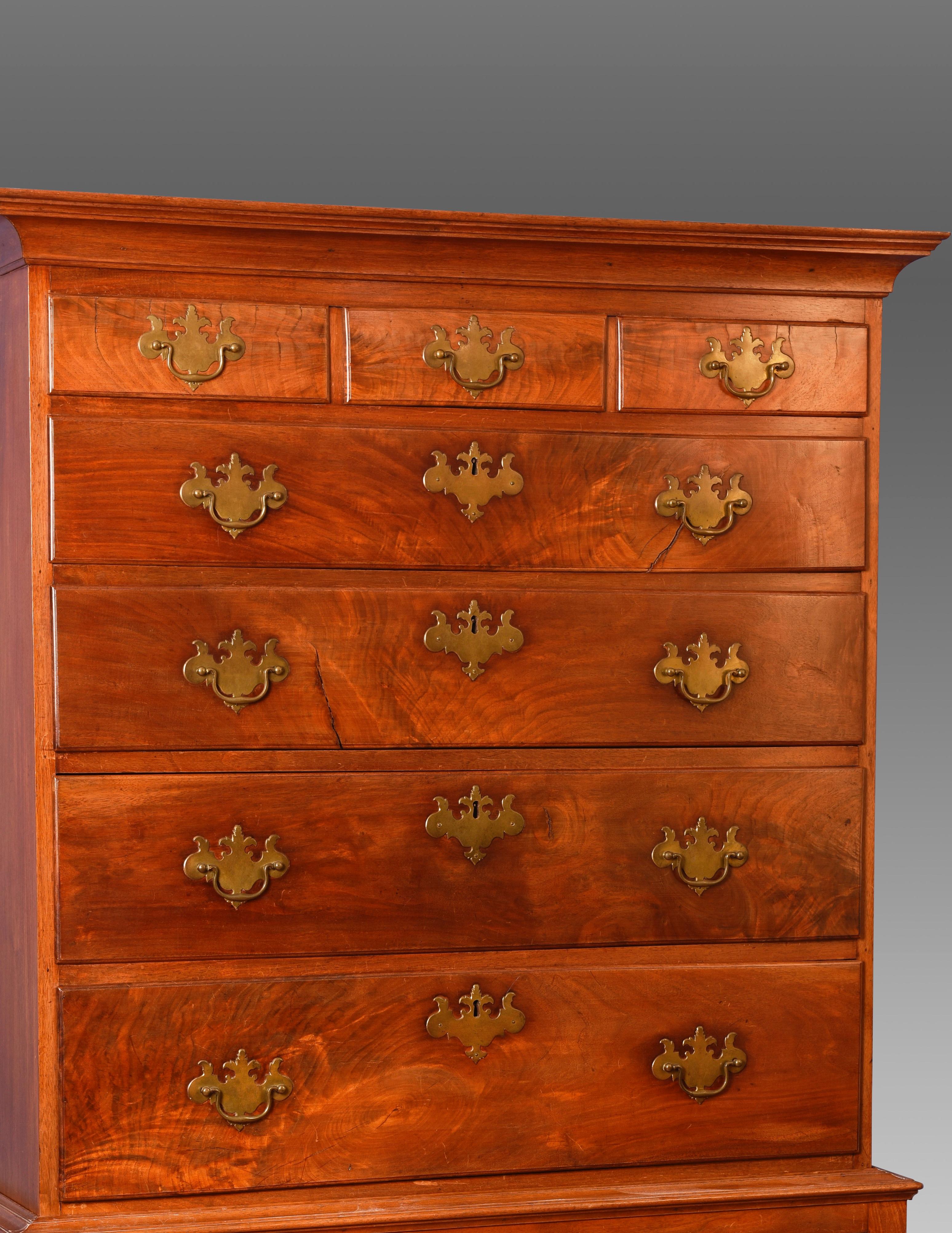 Walnut Queen Anne highboy with lovely figured wood drawer fronts. Nicely scalloped aprons and cabriole legs terminating in trifid feet.