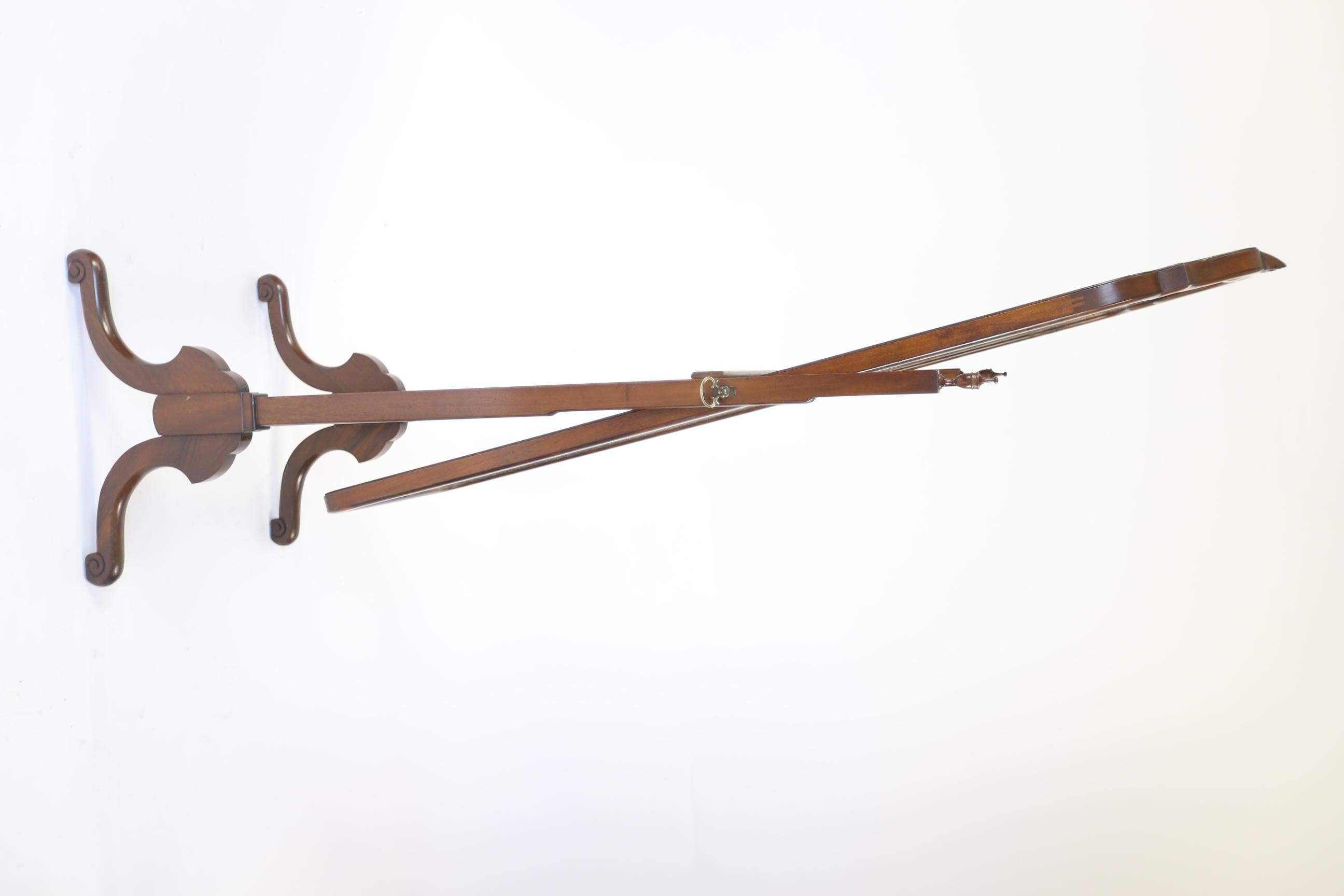 Walnut Queen Anne Style Cheval Mirror, circa 1930s
Arch Shaped Swing Centre Mirror with Carved Shell Finial, 
Pair Brass Screw support  bolts, 
Pair Tapered Supports with Turned Urn Shaped Finials. 
Walnut Panel Cross Stretcher, 
4 Shaped Legs with