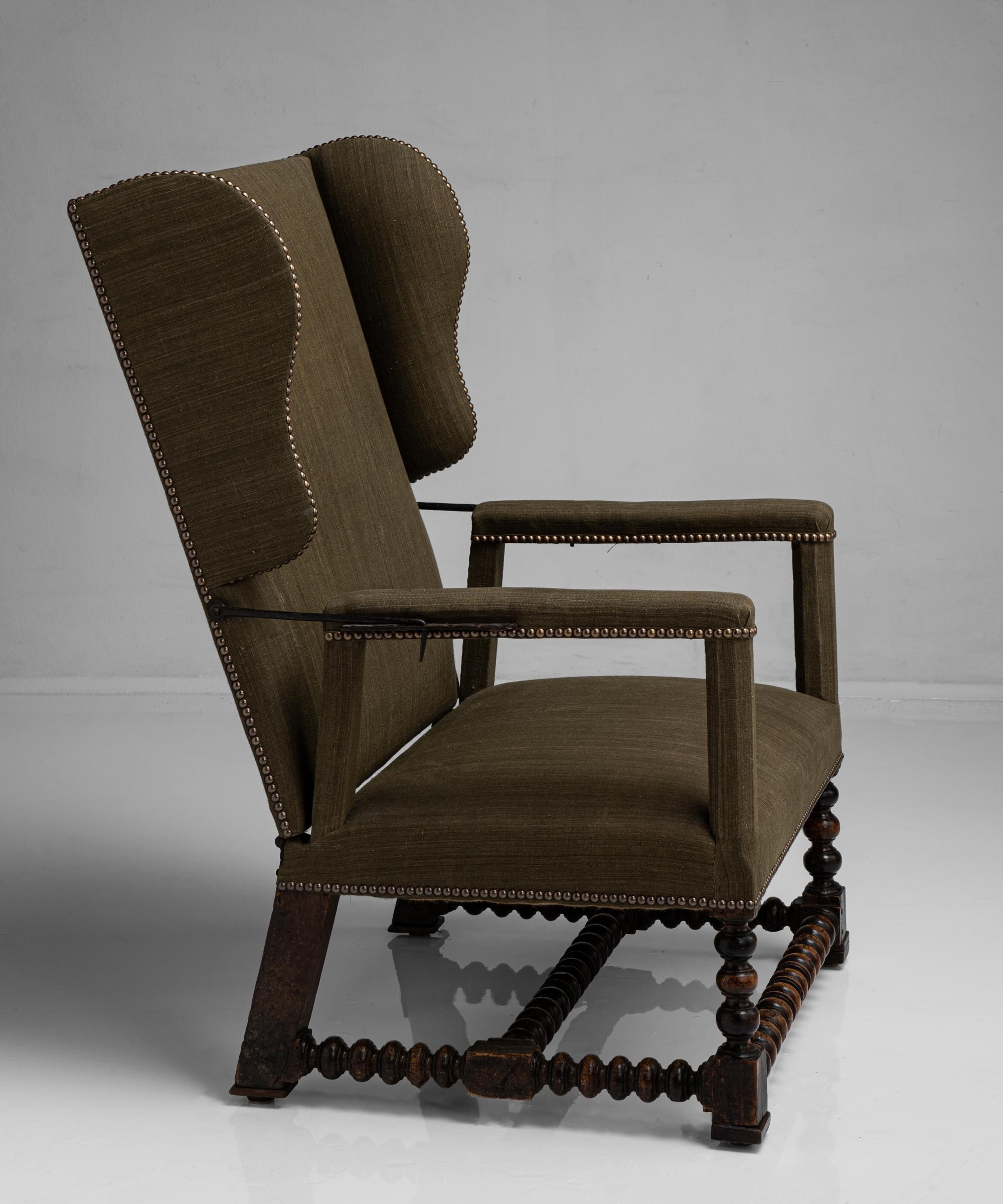 Walnut reclining armchair
France circa 1780

Newly upholstered, with bobbin turned legs and stretcher. Original reclining metalwork with four wrought iron pins and hole settings to each arm.

Measures: 27” W x 22” D x 41” H x 14”seat.